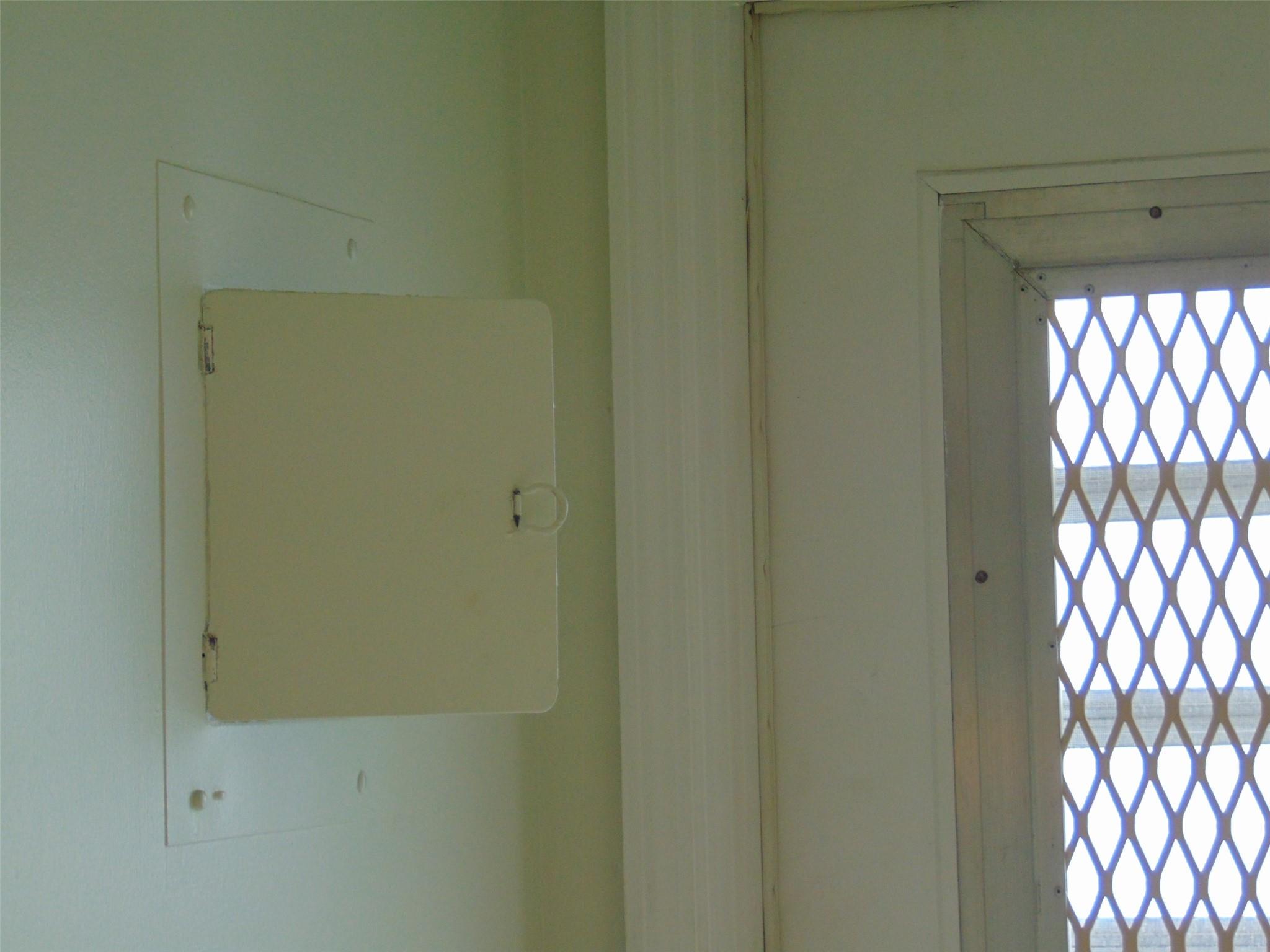THIS IS A GOOD THING. THE CIRCUIT BREAKER PANEL IS IN THE ENTRY FOYER. THIS ALLOWS ONE TO HANG NEW CABINETS ON THAT KITCHEN WALL AND NOT HAVE TO FLIP OR MOVE THE PANEL.