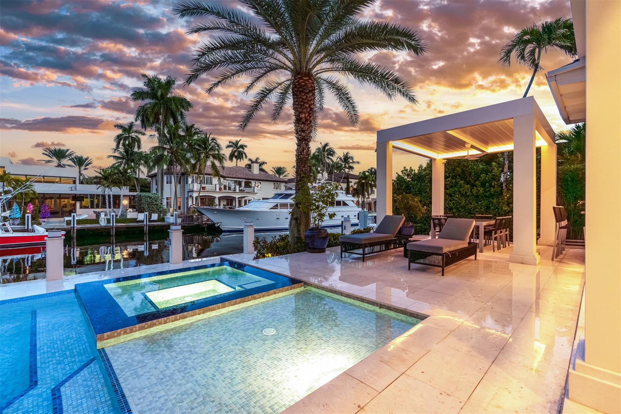 Enjoy waterfront views from your heated, saltwater pool.