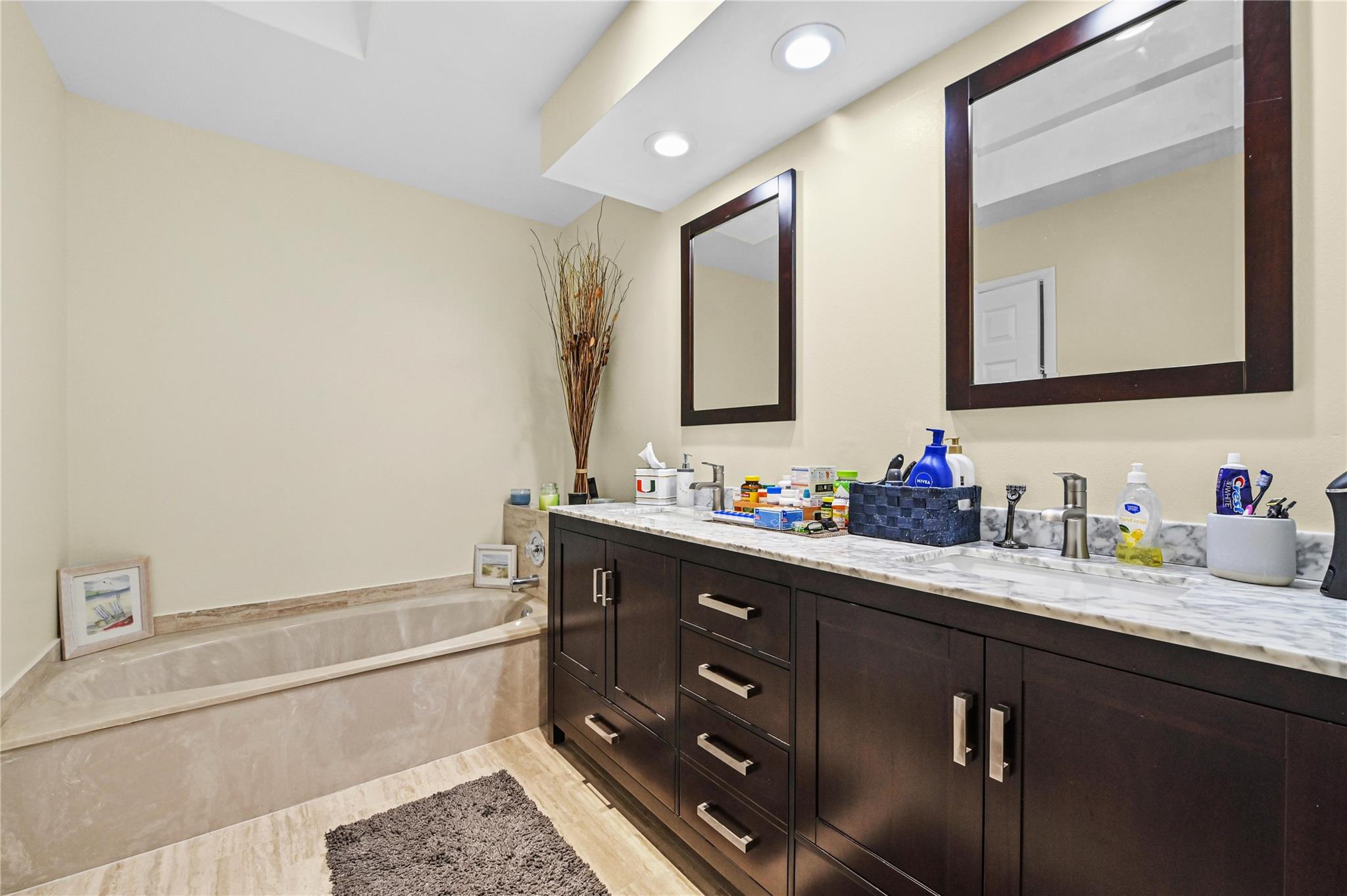 Primary bath has roman style tub and separate shower