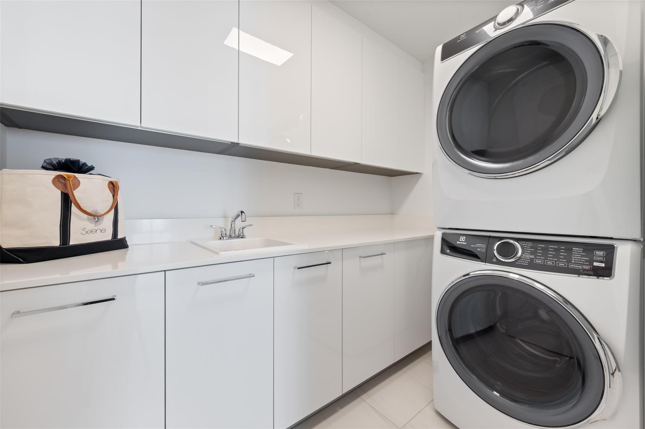 Laundry w/ sink and plenty of storage