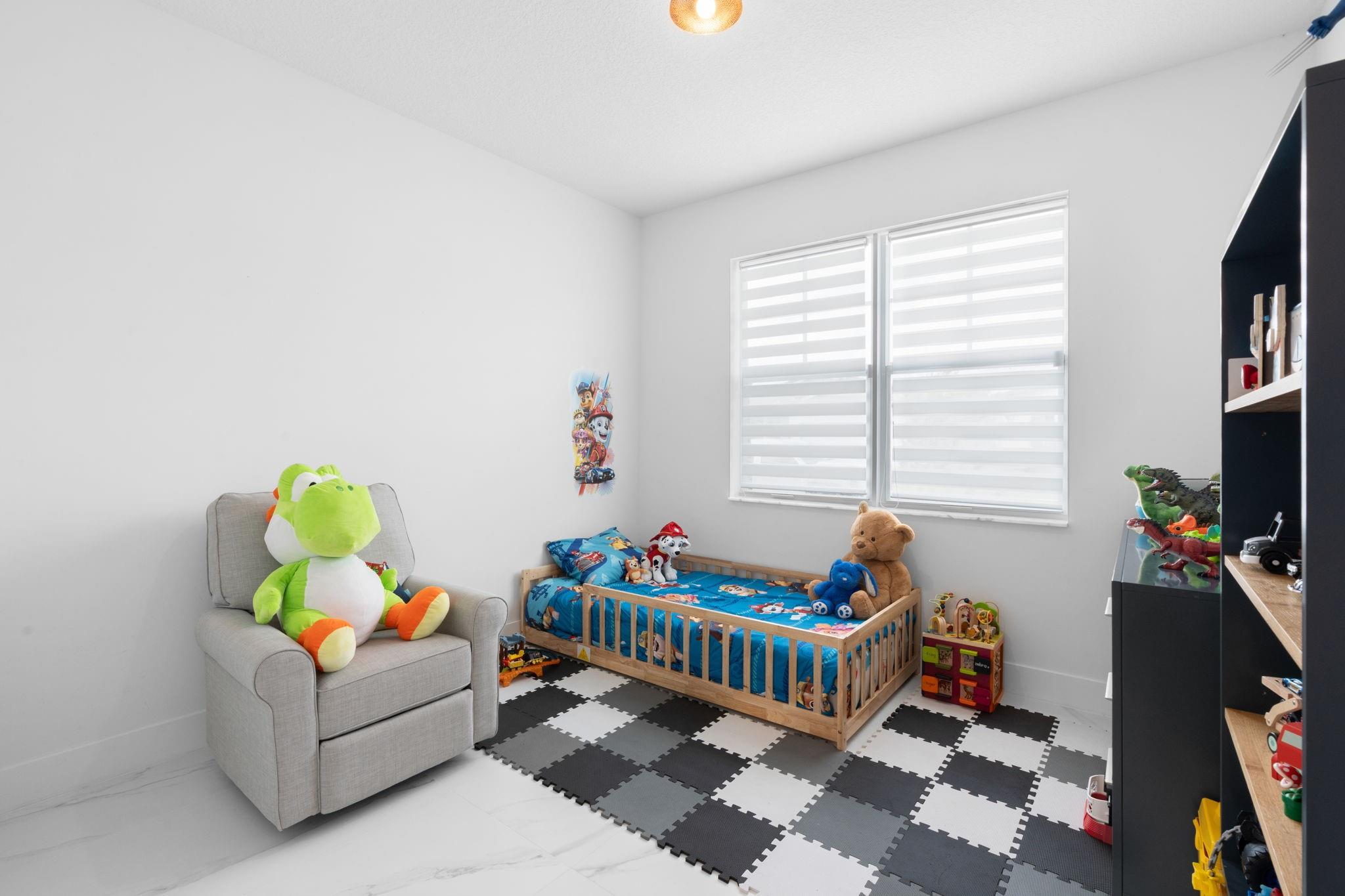 Bedroom #3 with Continuous Flooring Throughout the First Floor