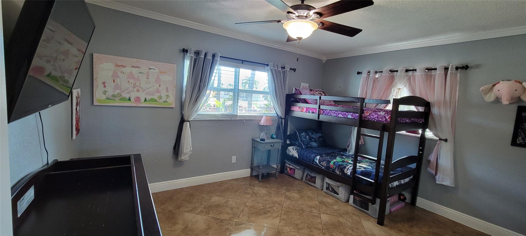 Comfortably sized bedroom with ample natural light.