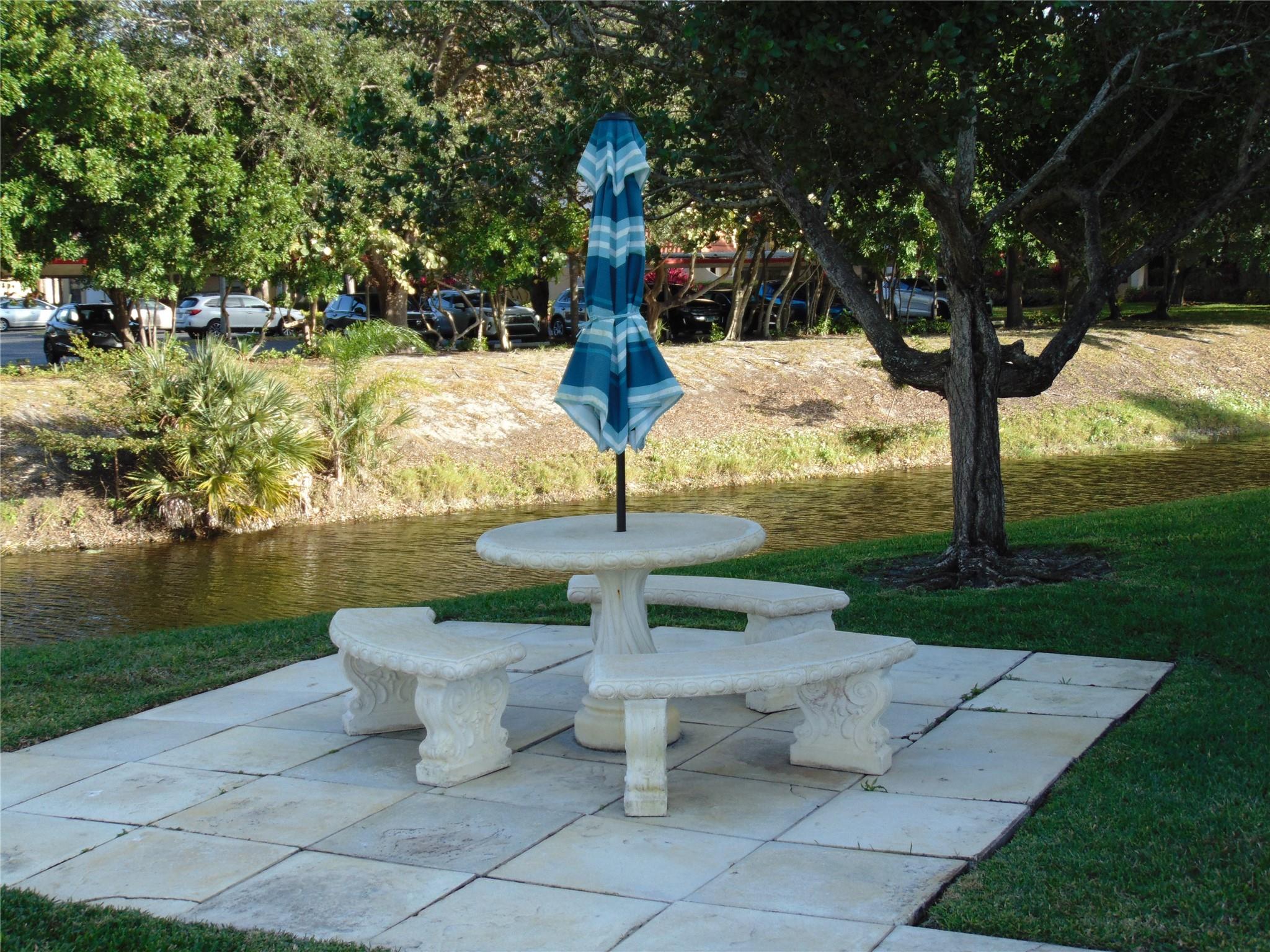 PATIO TABLES AT CANAL FRONT NEAR GAS BBQ GRILL