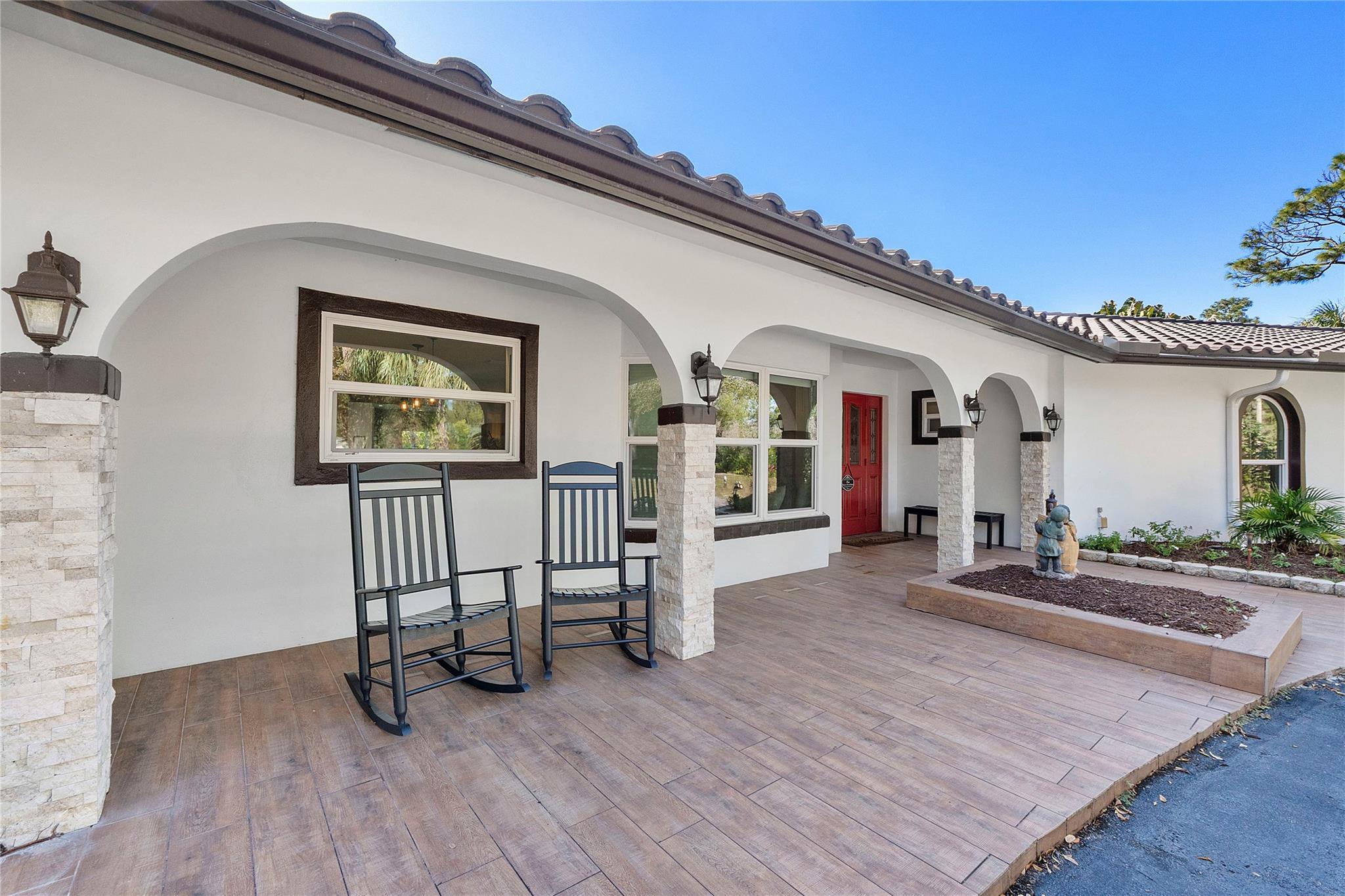 The Serene front porch to sit and watch the sunrise with your morning coffee