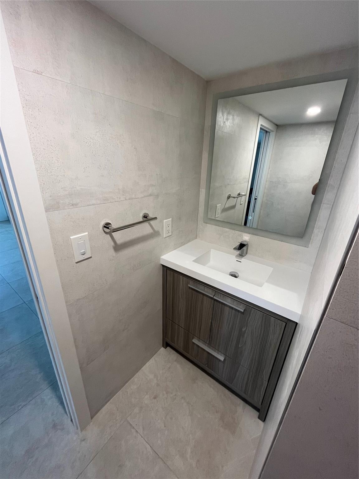 The half bathroom is easily accessible for guests.