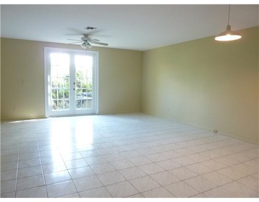 LIVING & DINING ROOM W/FRENCH DOORS TO WOOD DECK PATIO