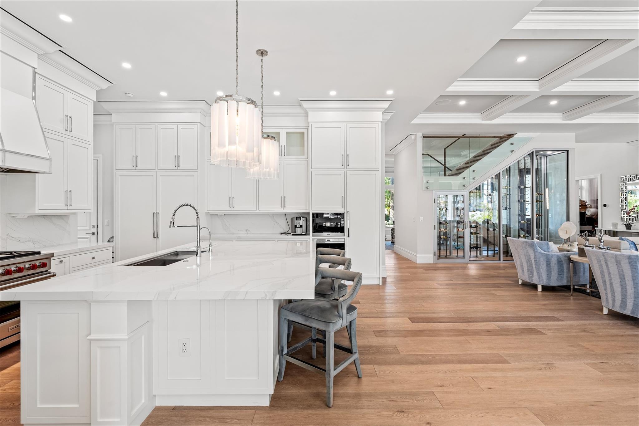 A chef's dream! Equipped with Sub-Zero and Wolf appliances. Overlook your main living space while eating and cooking.