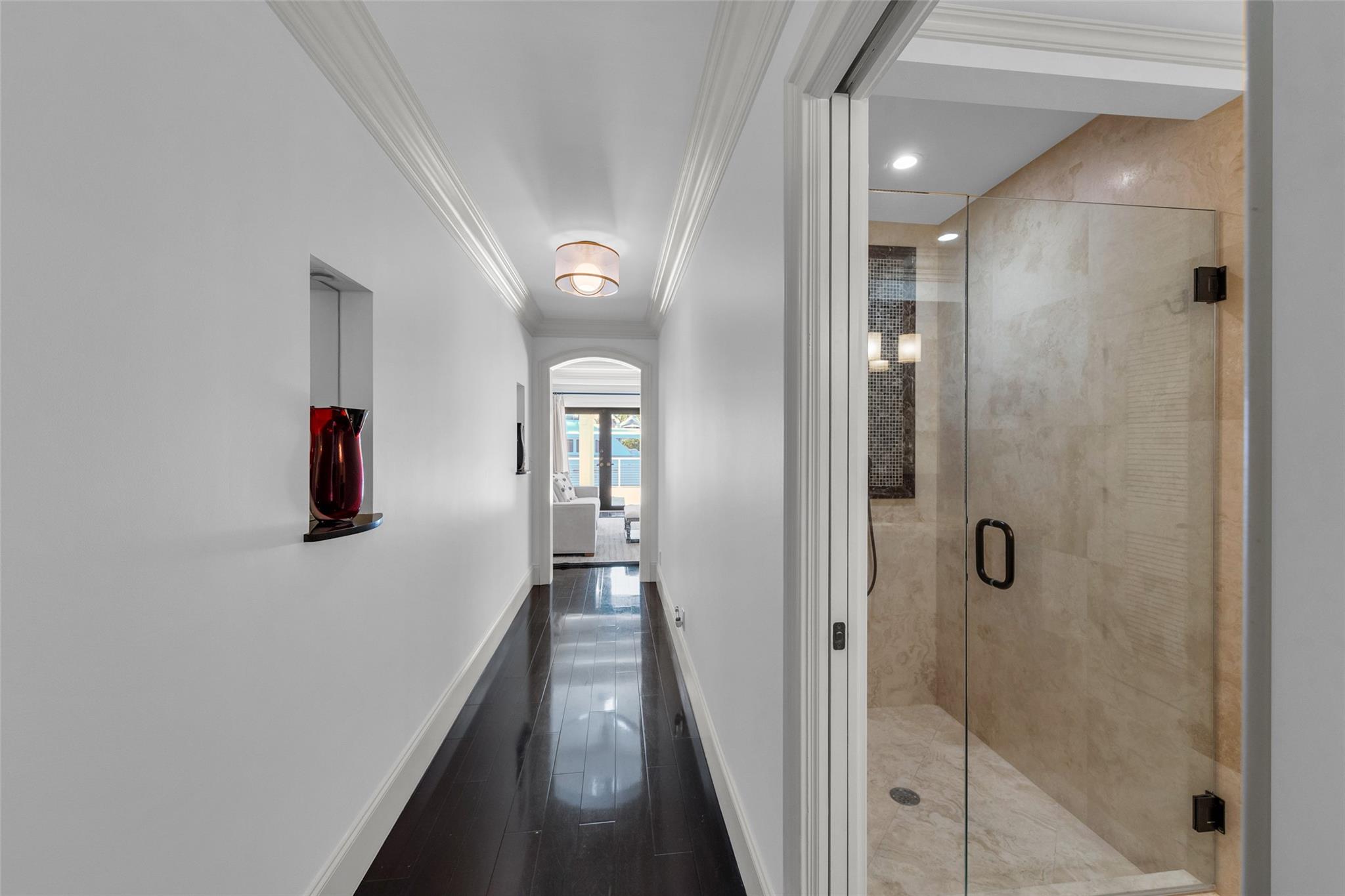 Formal foyer & hallway into the Primary Bedroom Wing on entire south side of residence