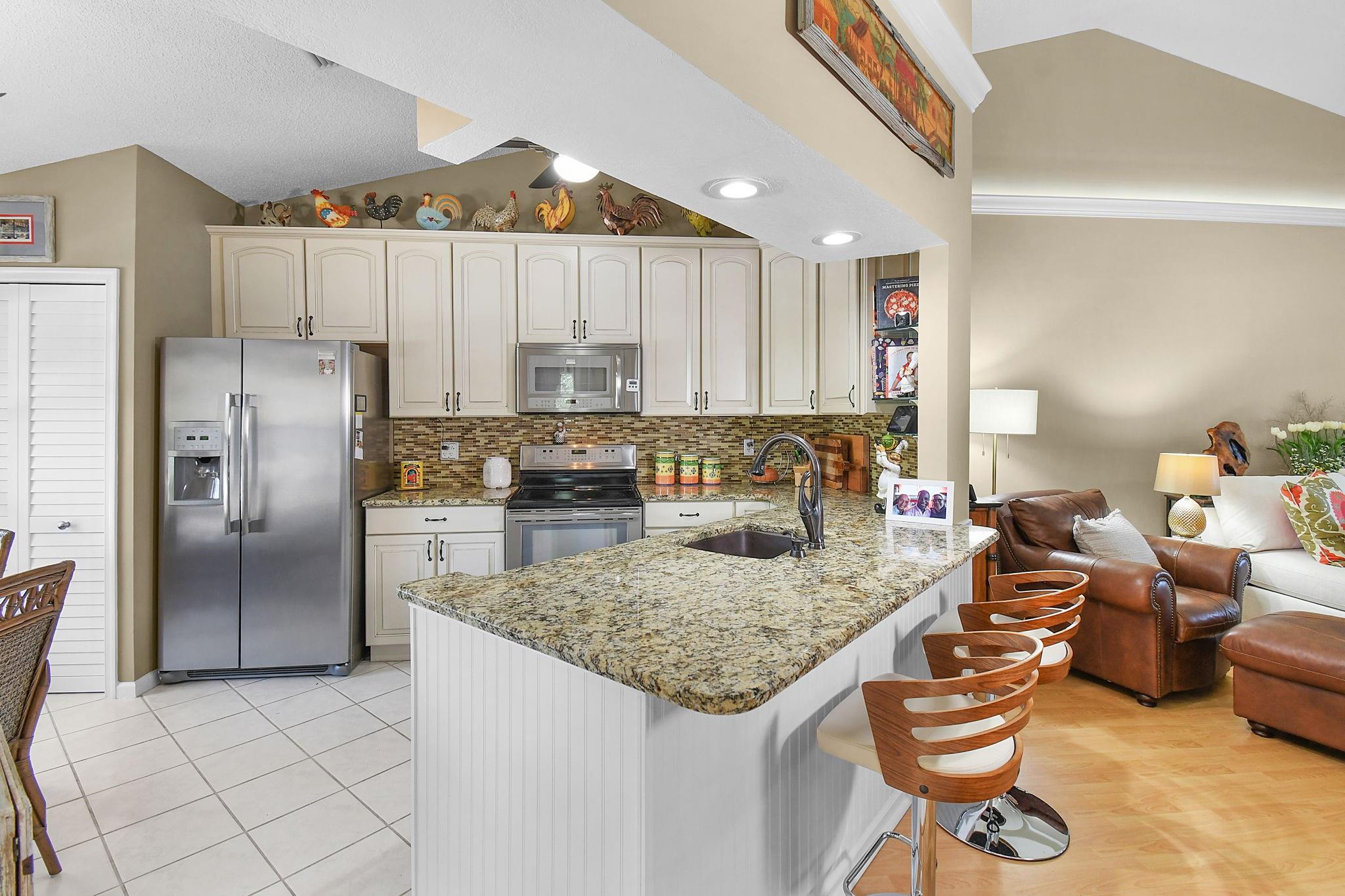 BRIGHT KITCHEN OPEN TO LIVING AREA