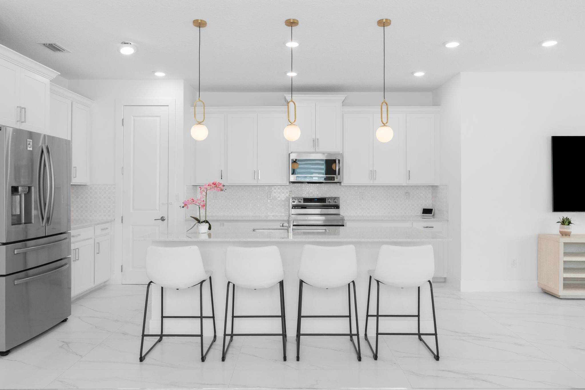 Quartz Counter with Island Sink and Breakfast Bar Seating