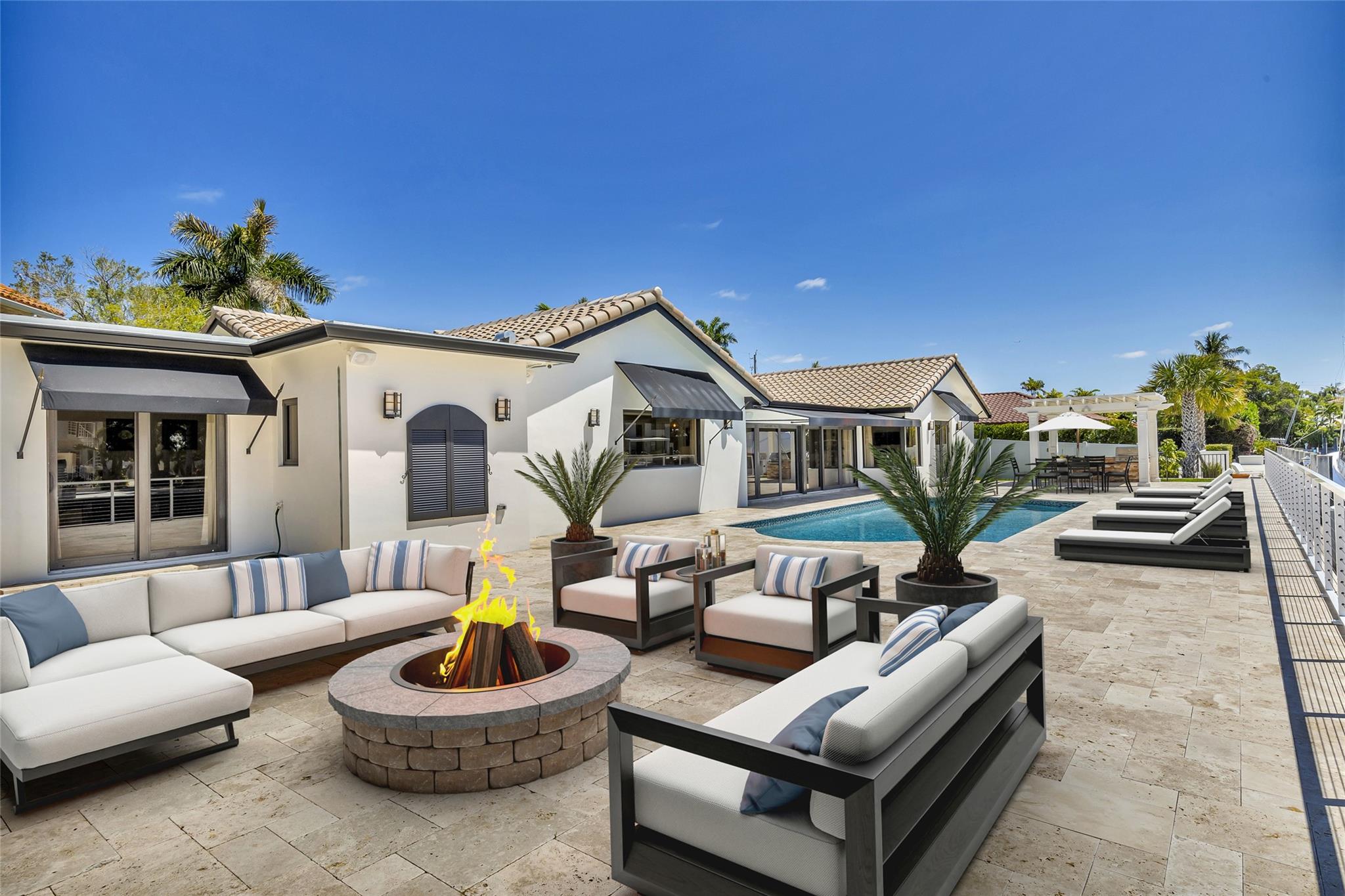 Spacious backyard patio & pool area (Virtually Staged)