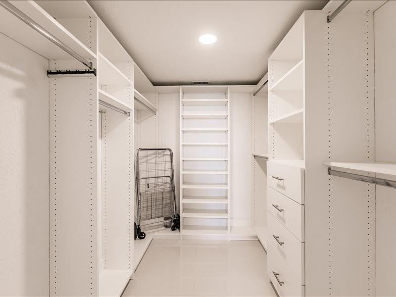WALK IN CLOSET WITH BUILT INS