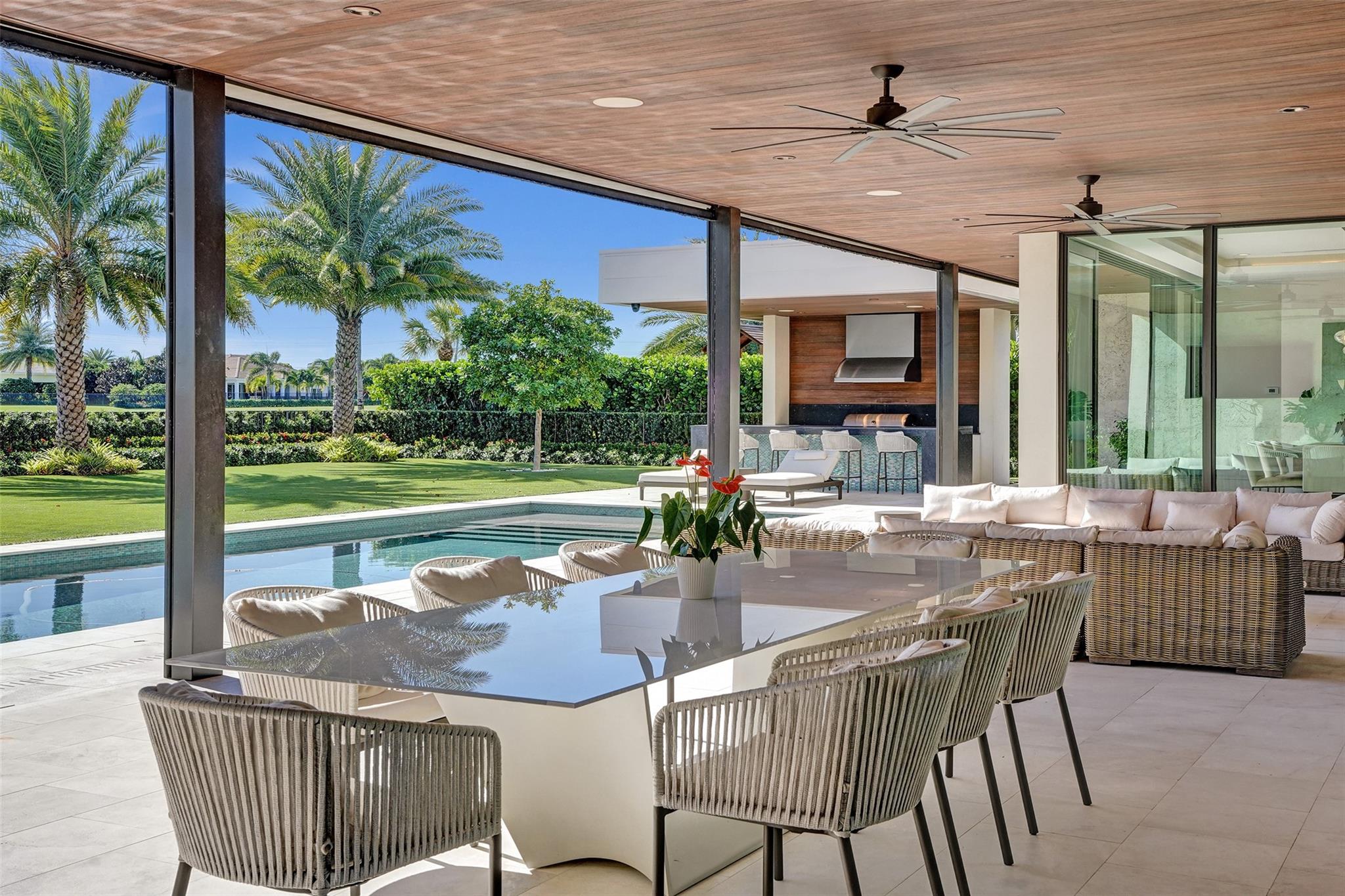 1st floor covered porch with hidden and retractable screens. Over 1000 sq feet