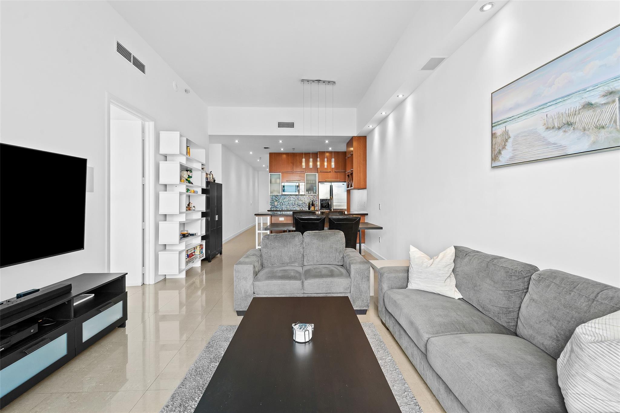 Living Space, Dining Area, and Kitchen seen from the balcony