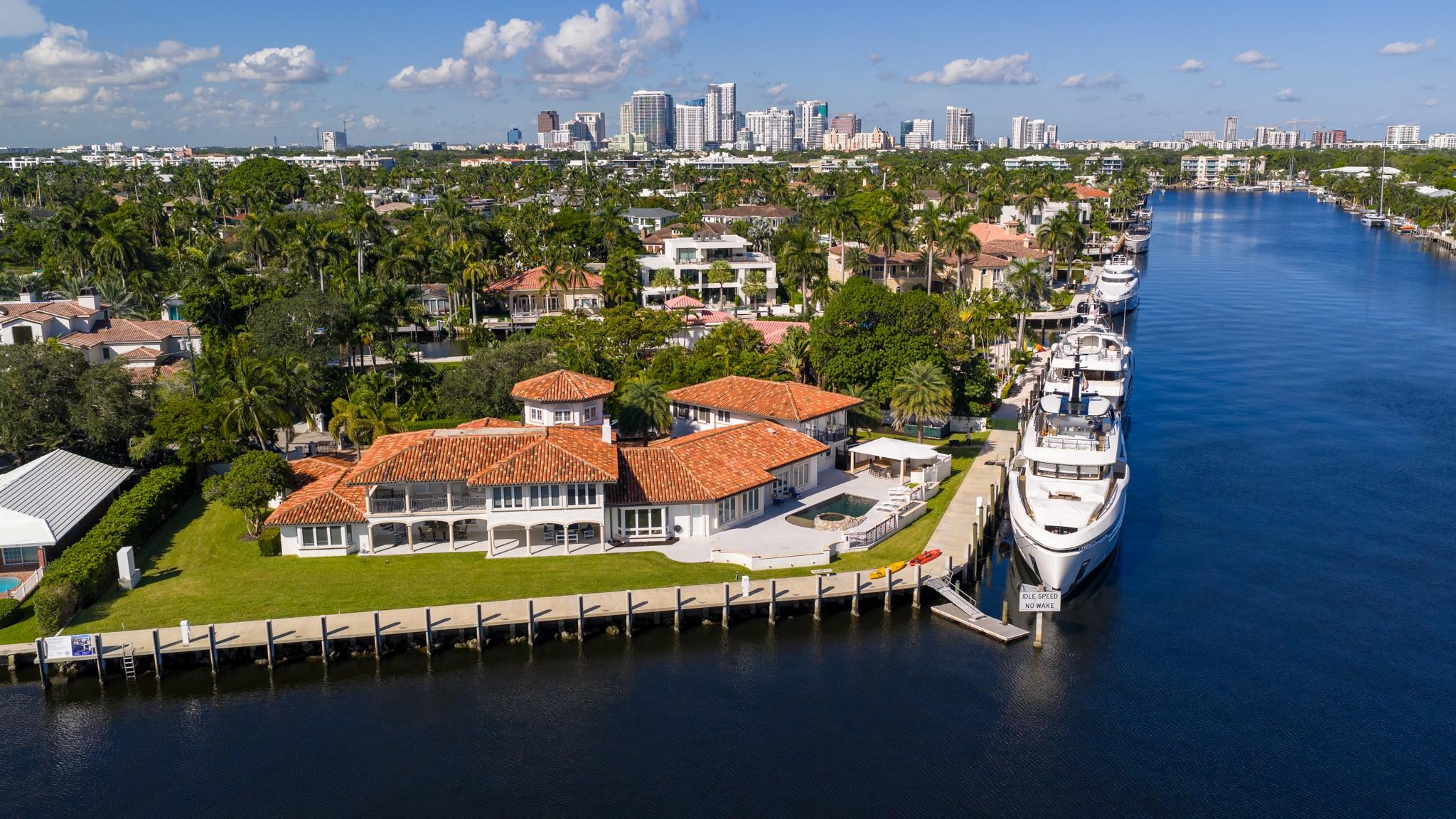 Expansive point-lot estate with 315 feet of waterfront, skyline views, and mega-yacht dockage along Fort Lauderdale’s premier waterways.