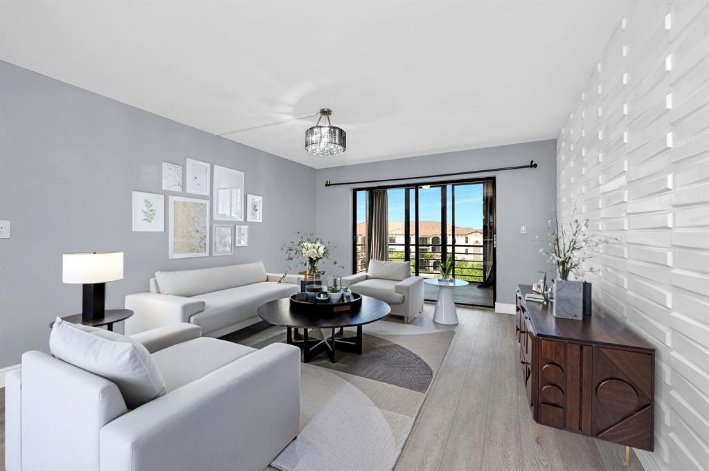 Photo for 9355 SW 8th Street, 401 401, Boca Raton, FL 33428 - listing #FX-10532636 Beautiful modern textured walls in the living room and screened patio offering breathtaking sunset views.