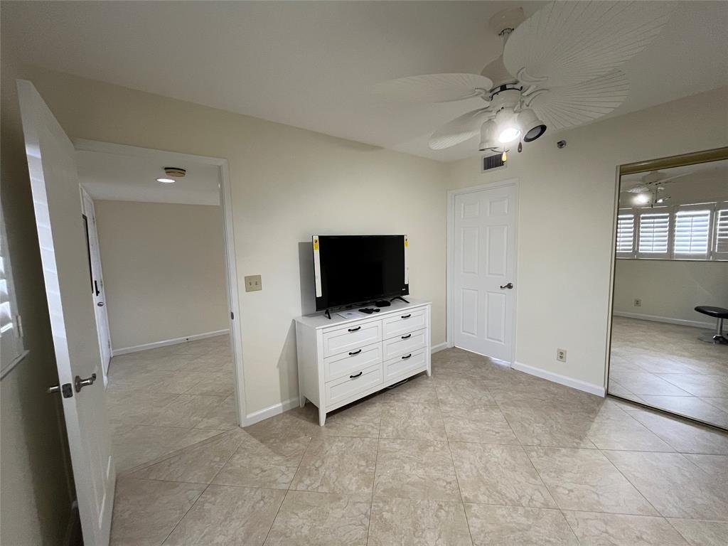 Spacious second bedroom with new television.