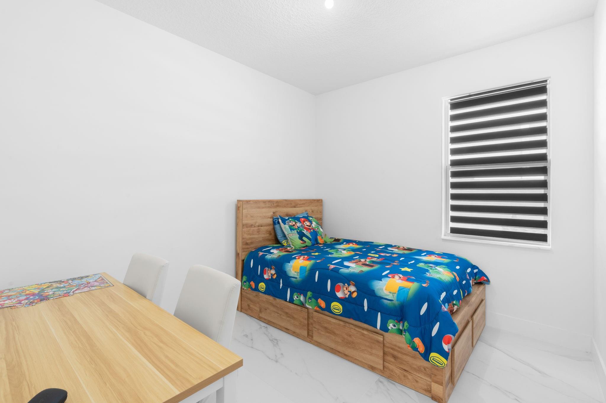 Bedroom #2 with Continuous Flooring Throughout the First Floor