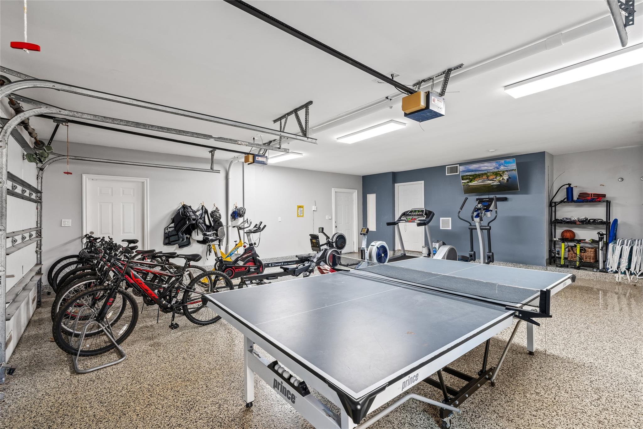 An elegant staircase adorned with intricate wrought-iron railings and warm wood treads, illuminated by soft natural light from an arched window above. Graceful and architecturally refined, this statement feature adds timeless sophistication to the home’s grand interior.