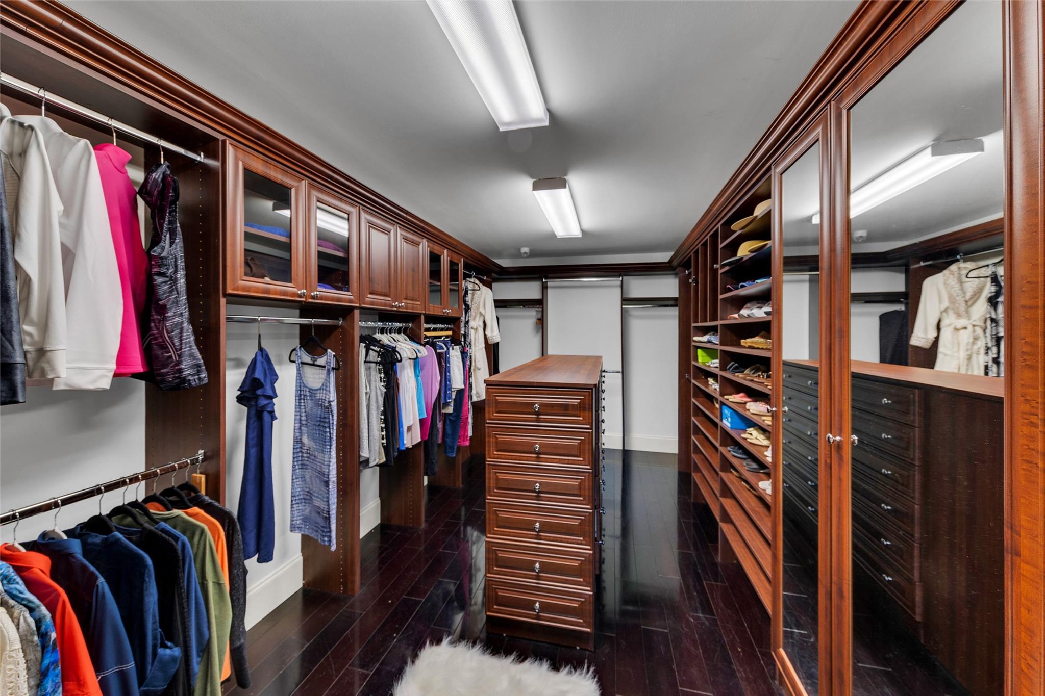 The expansive "Her" primary walk-in closet