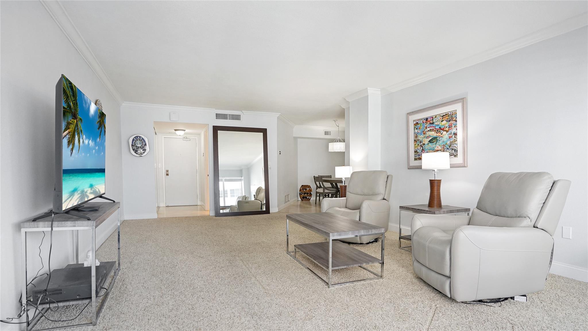 The front door is visible here. The half bath, which houses the washer and dryer, is to the right of the front door.