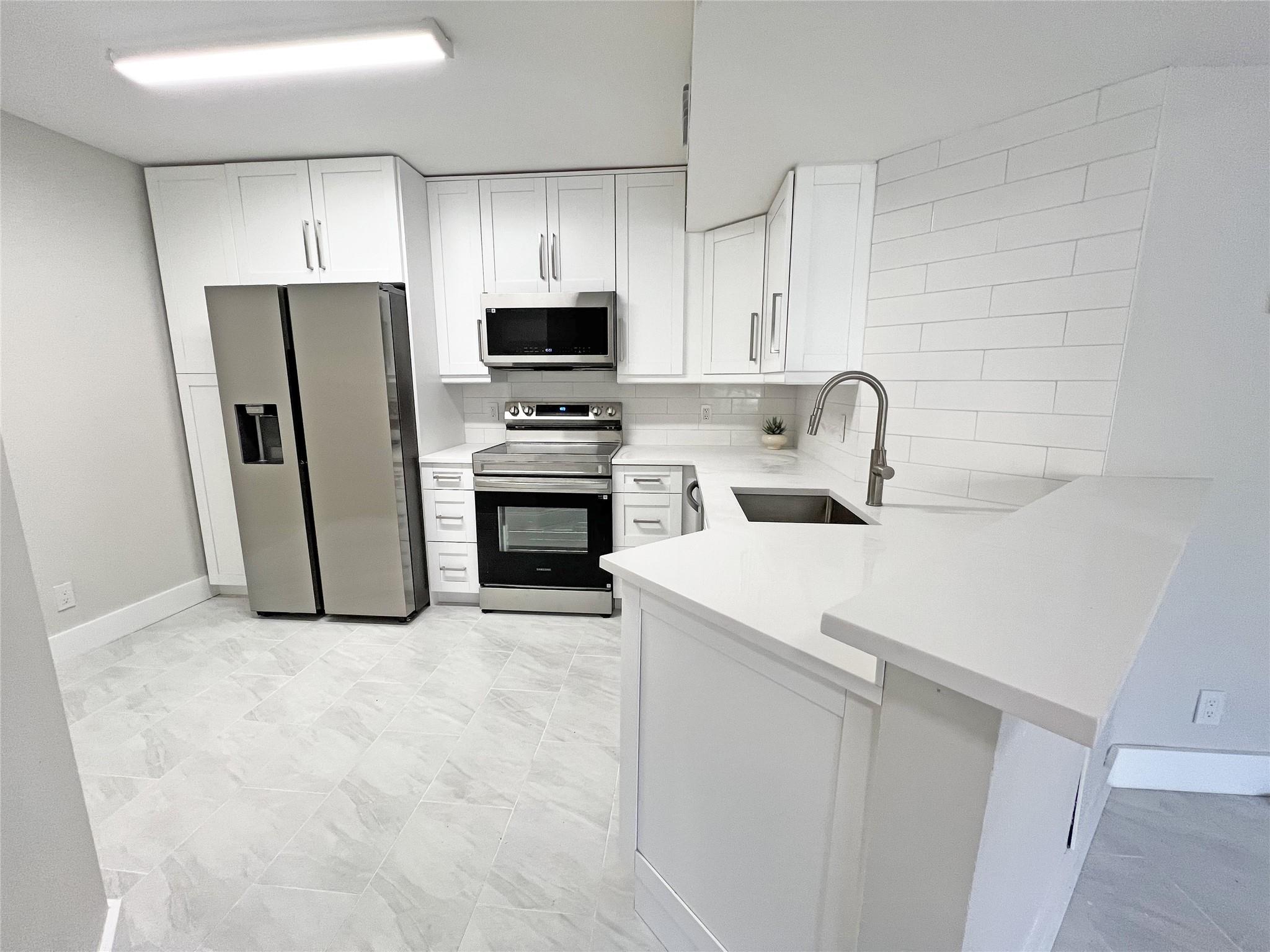 9055 Wiles Road 208, Coral Springs, FL 33067