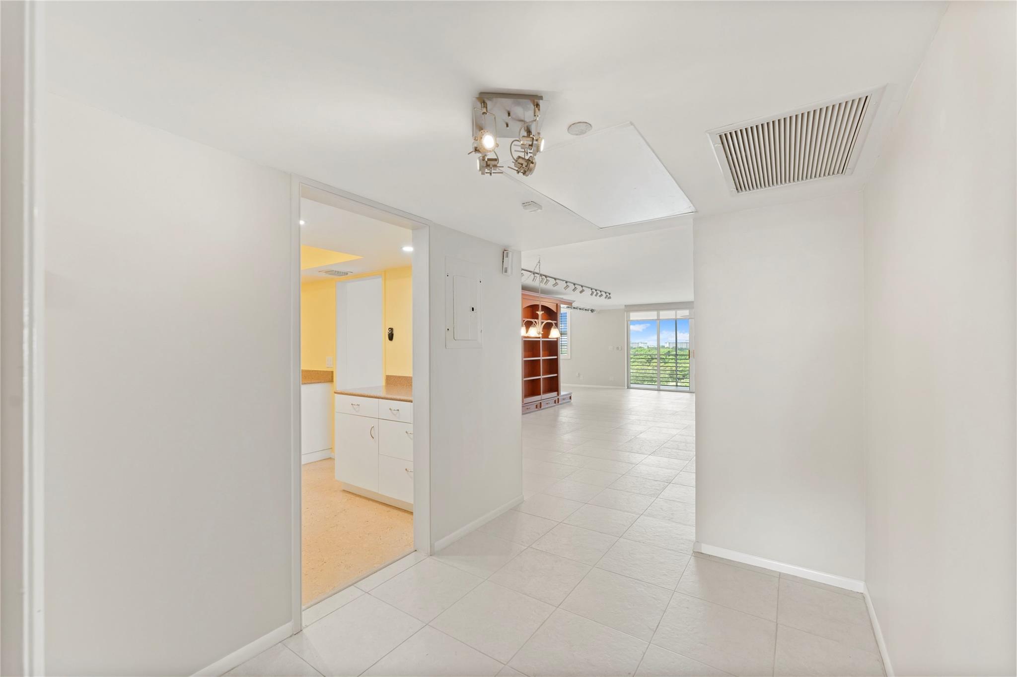 Photo for 3095 N Course Drive, 807, Pompano Beach, FL 33069 - Listing #FX-10508002 Kitchen off entry with full size stach washer/dryer