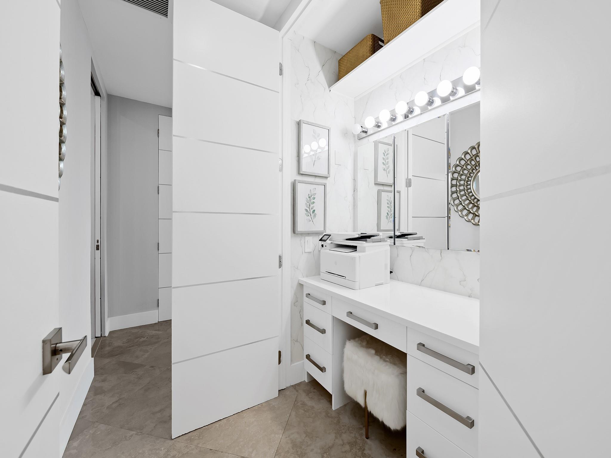 Extra closet space thoughtfully designed as a home office desk or make up vanity.