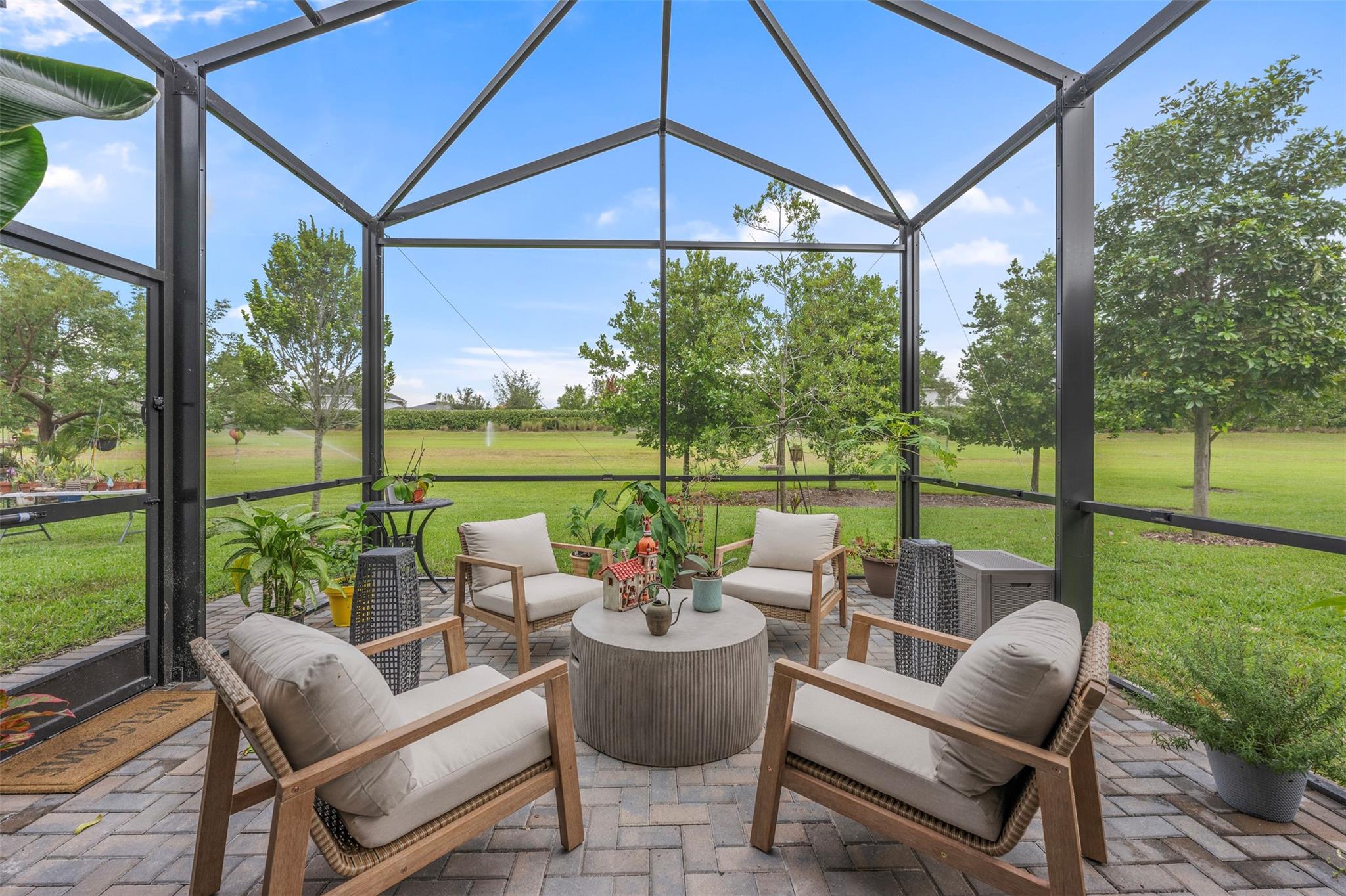 Photo for 19707 Weathervane Way, Loxahatchee, FL 33470 - listing #FX-10536604 Expanded screened in patio backing up to green space.