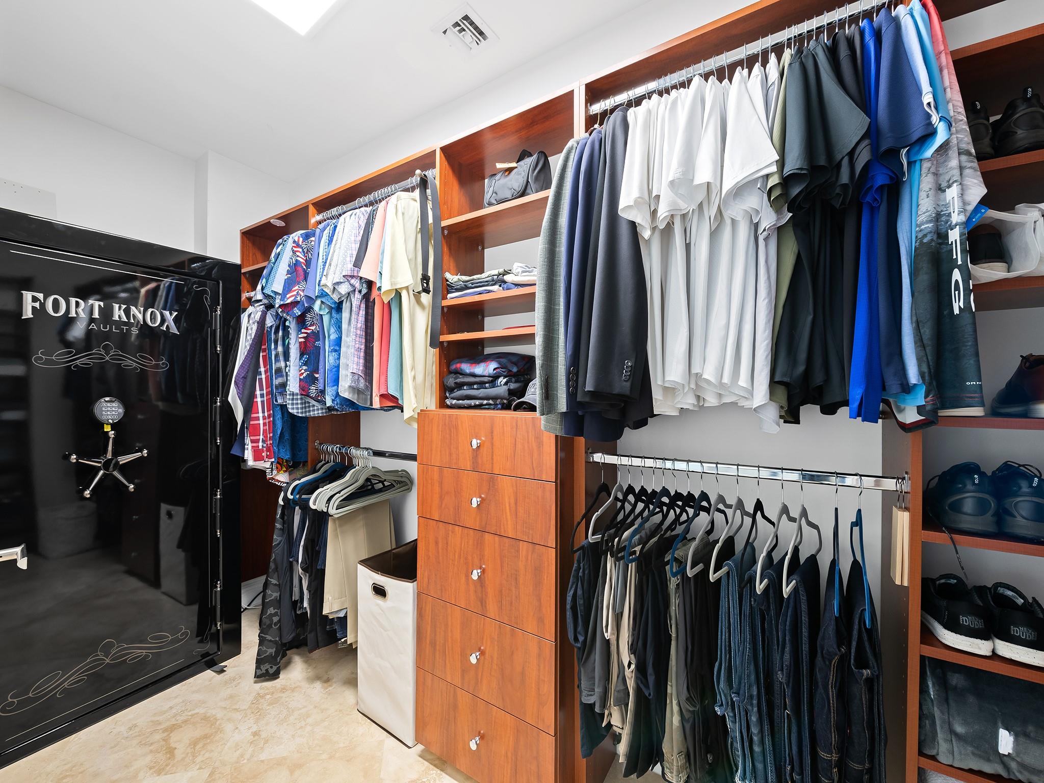 Both the his and hers closets include a generously sized safe.