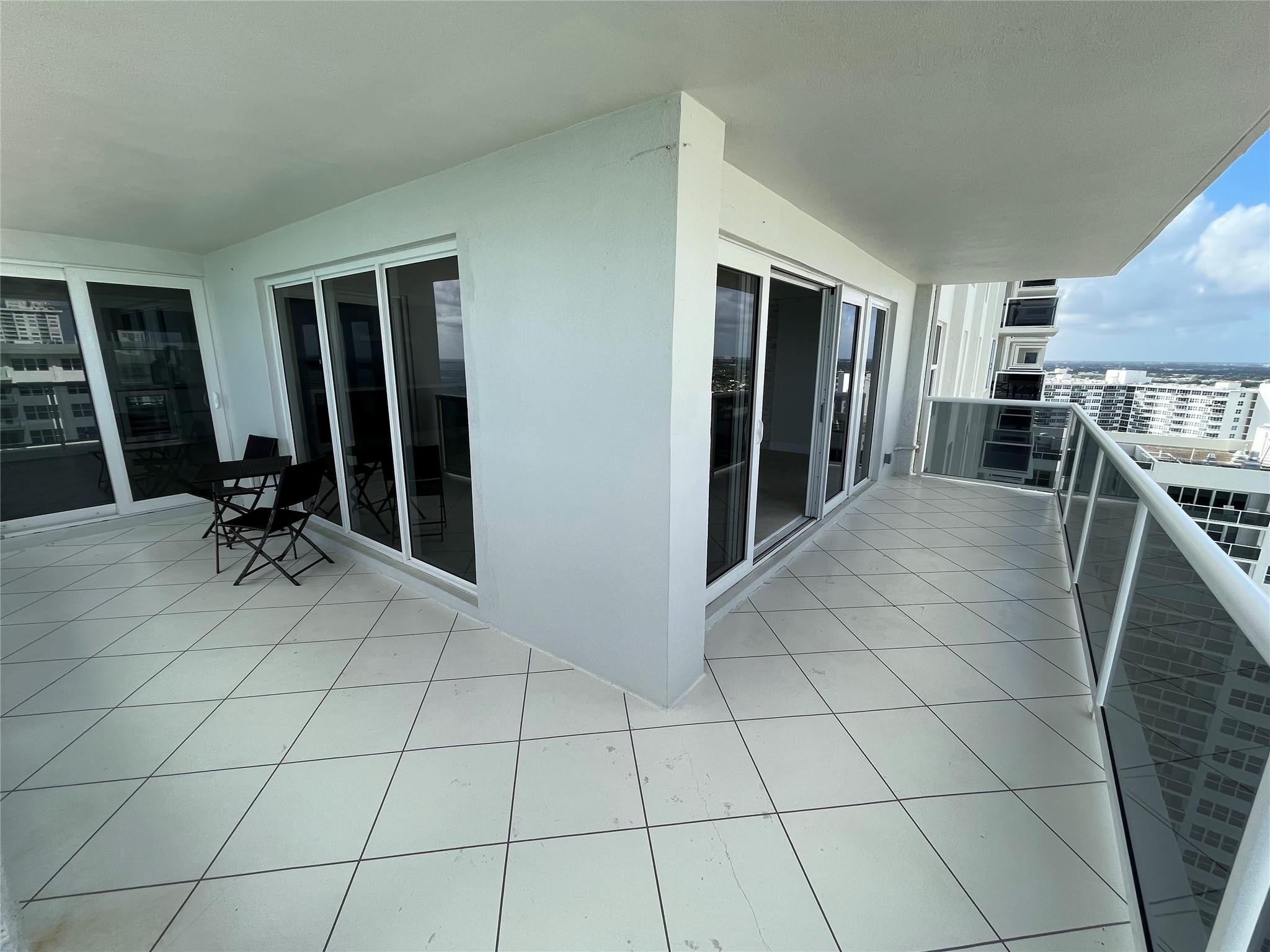 The wraparound balcony offers sliding glass doors with two separate doorways to the balcony.