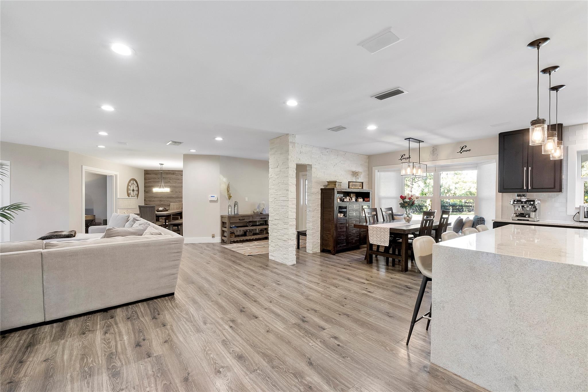 The spacious living room is open to the Piano room, The formal dining room, The kitchen and the casual dining room, plus the prettiest informal dining room and social room that leads to your own private office overlooking the pool & gardens