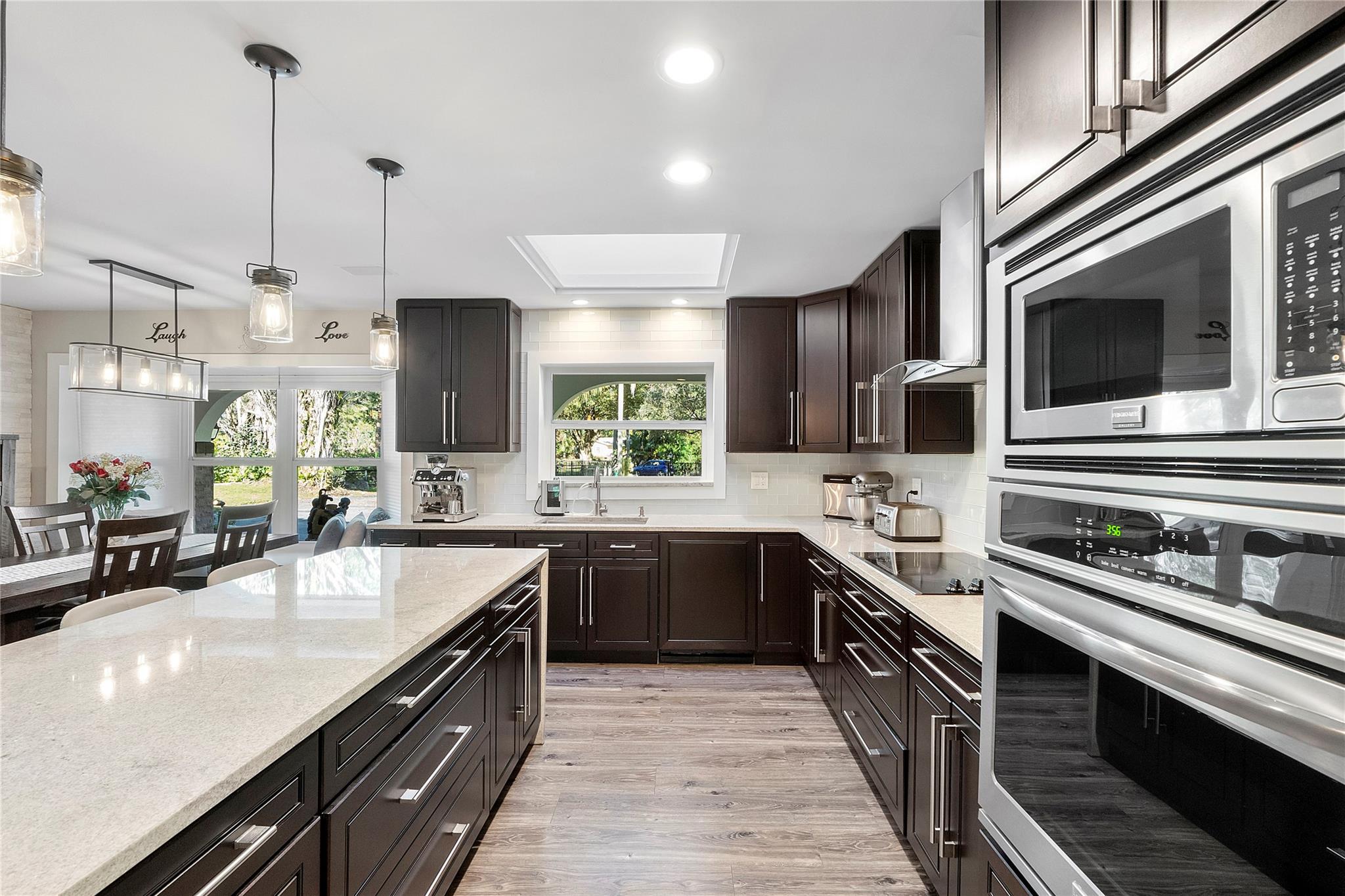 The kitchen has ample cabinet storage for all size pots an pans