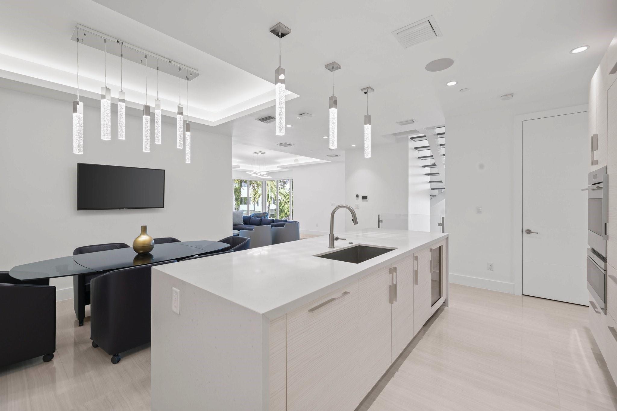 Extra large kitchen island with sink and wine cooler. Perfect for entertaining