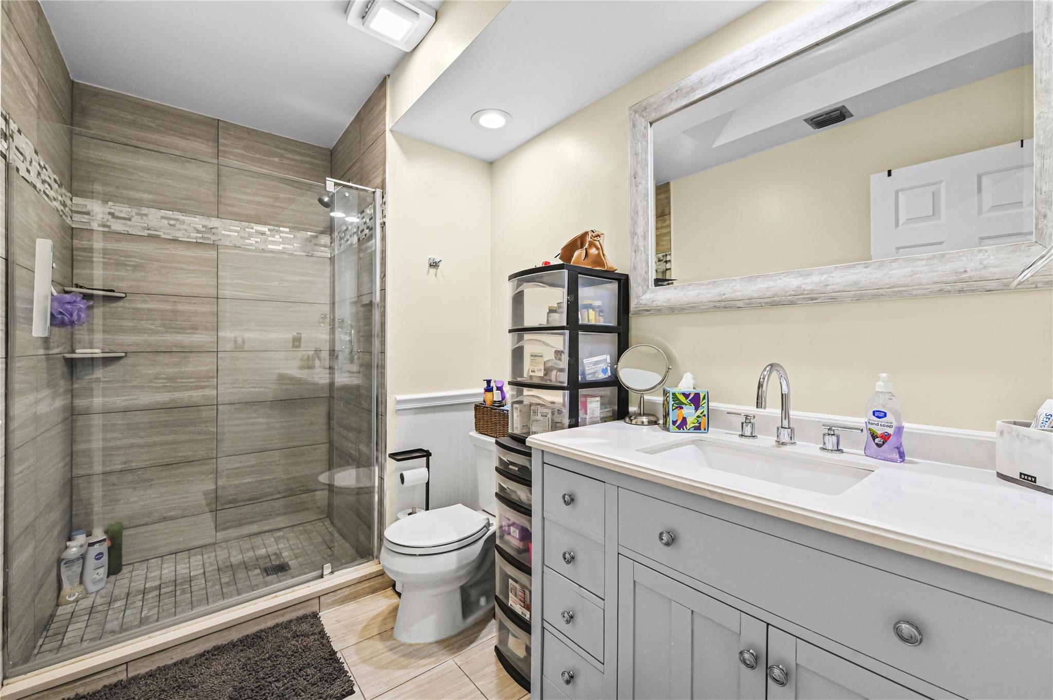 Upgrade guest bath with designer shower and seamless shower doors