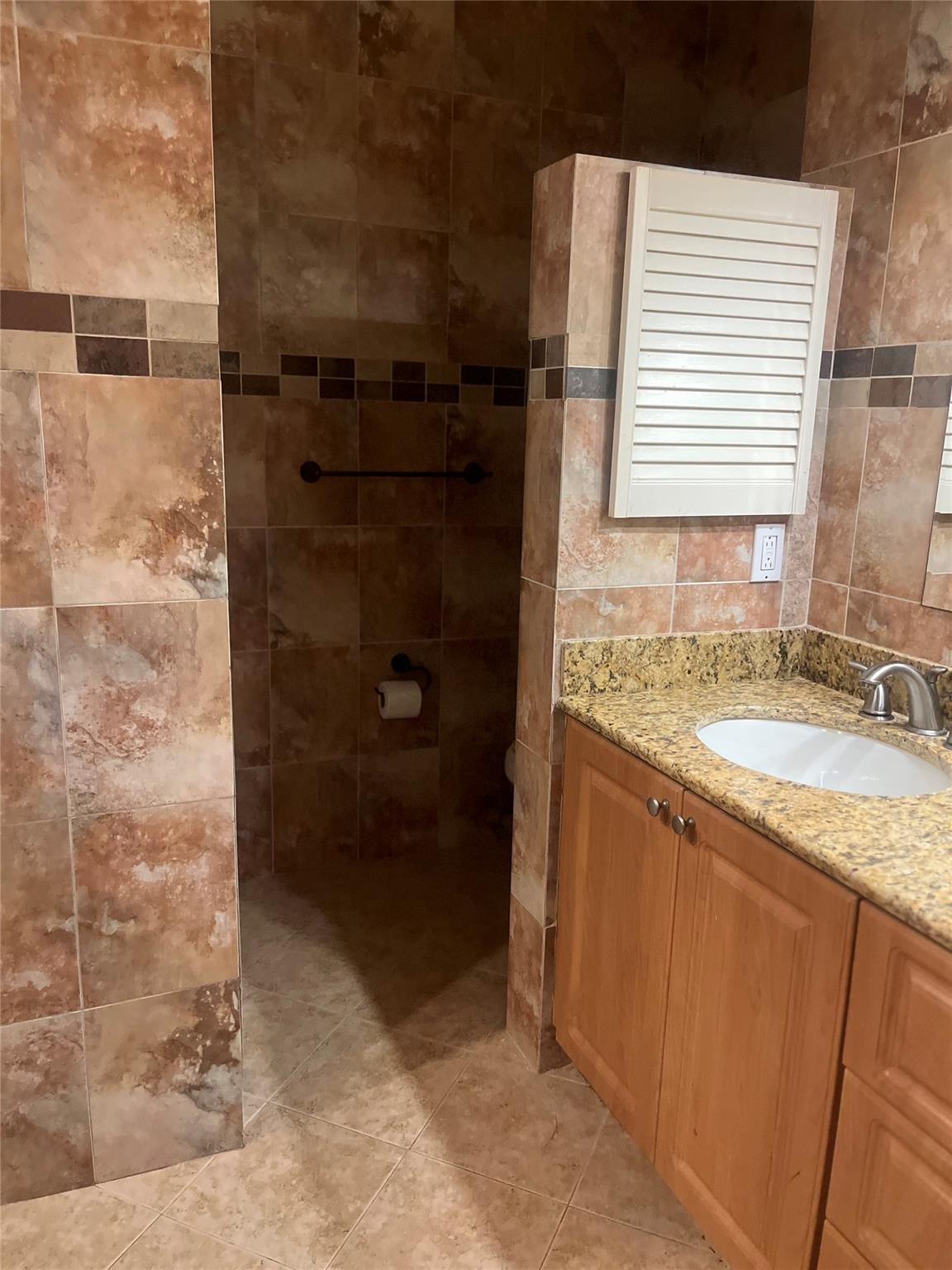 Photo for 8620 SW 12 Street, Pembroke Pines, FL 33025 - Listing #FX-10517624 Toilet behind partial wall for additional privacy