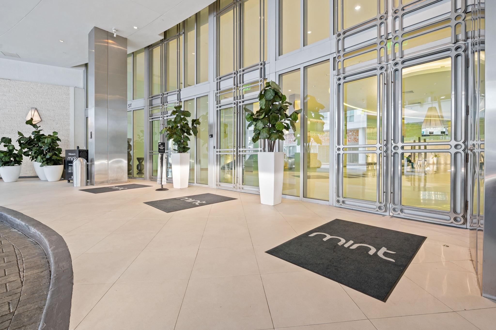 GRAND RIVERFRONT ENTRANCE WITH RESORT-STYLE DESIGN