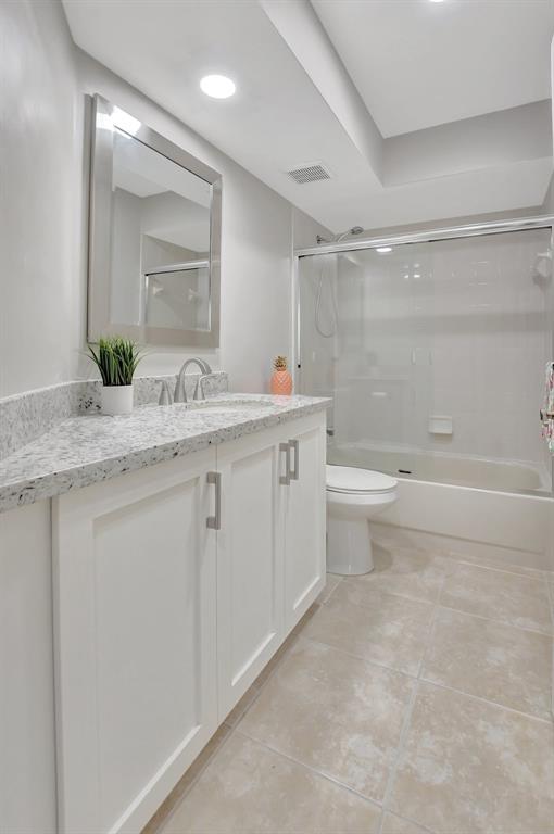 Photo for 5801 Coach House Circle, Unit E, Boca Raton, FL 33486 - Listing #FX-10436780 Tub is tiled to the ceiling and has two shower heads.