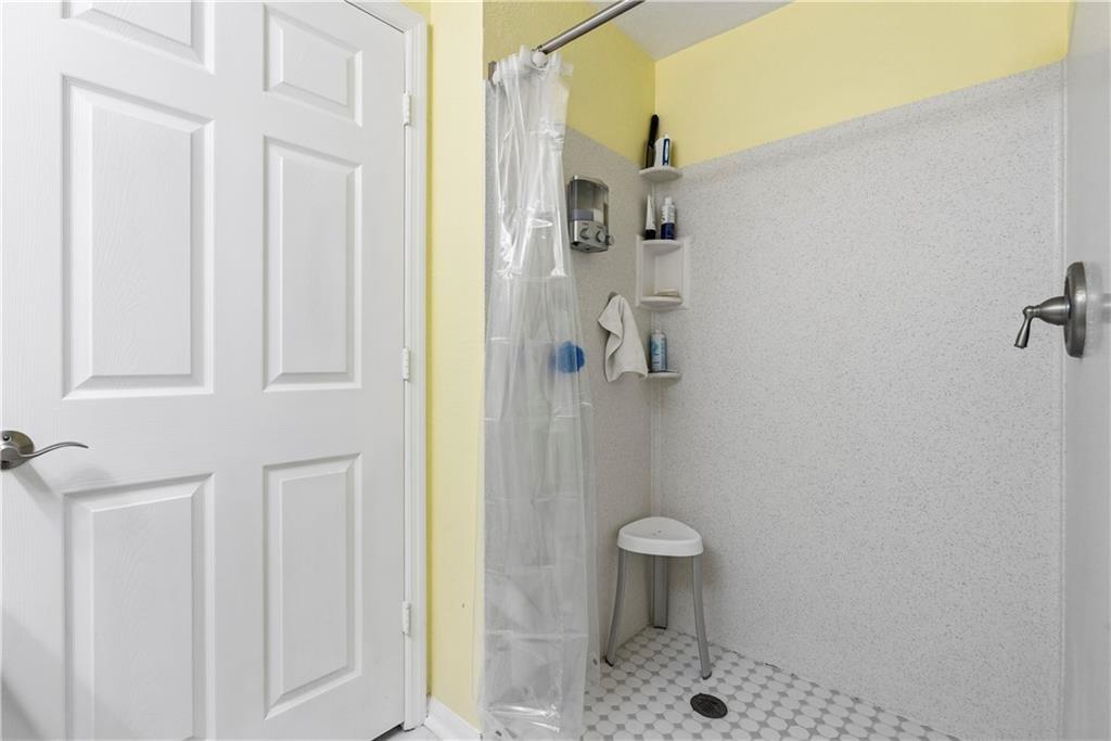 Bathroom featuring a shower stall