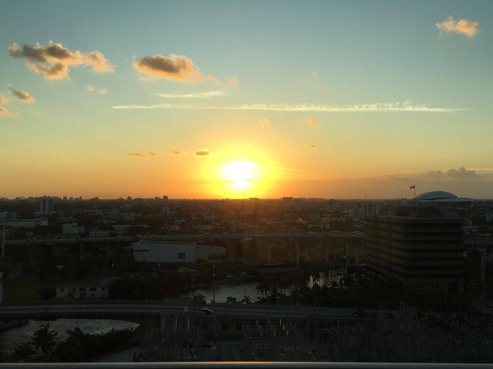 VIEW OF SUNRISE OVER MIAMI RIVER AND MIAMI FROM APT. 1807