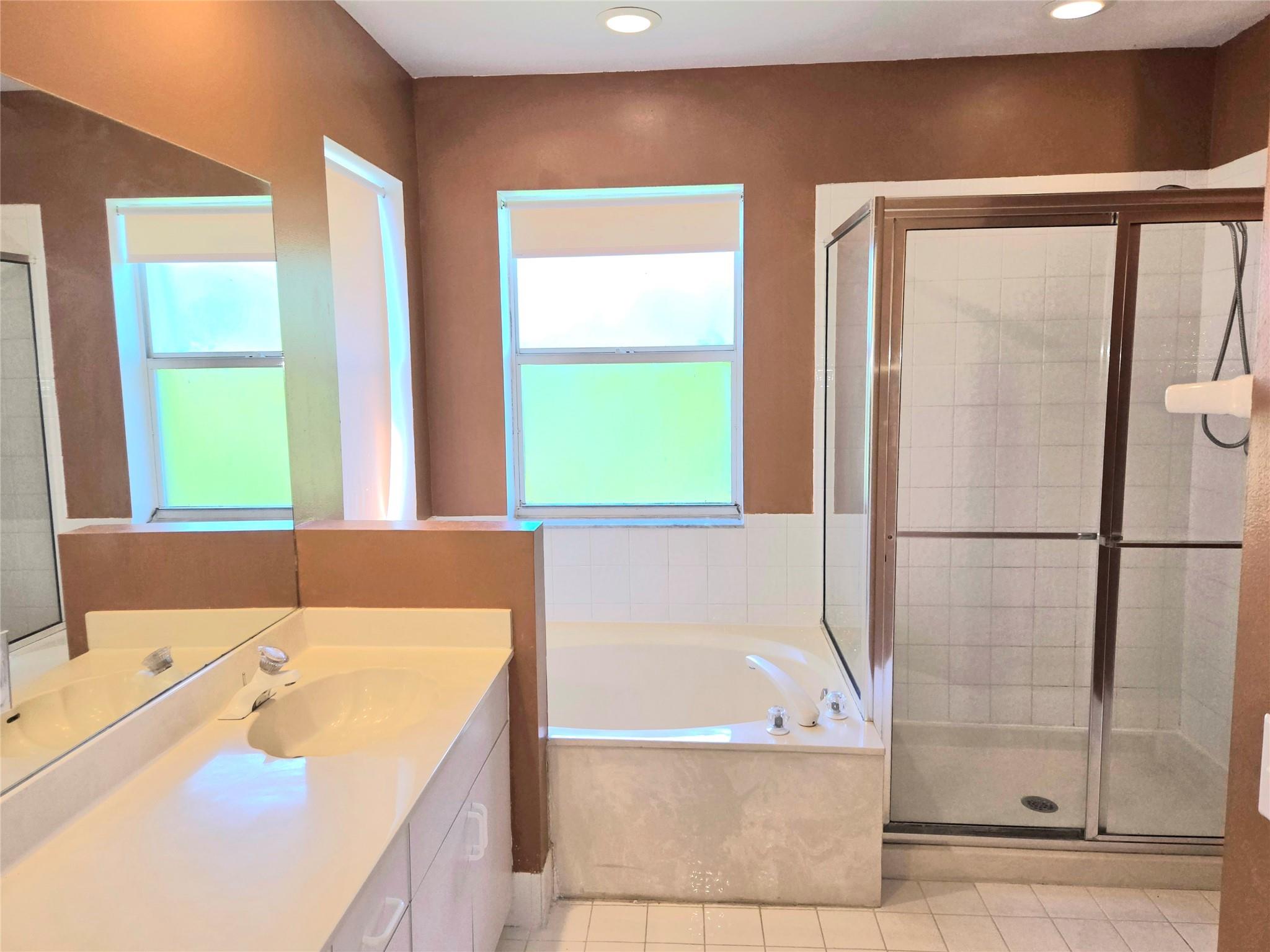 The master bath has a separate tub and shower.