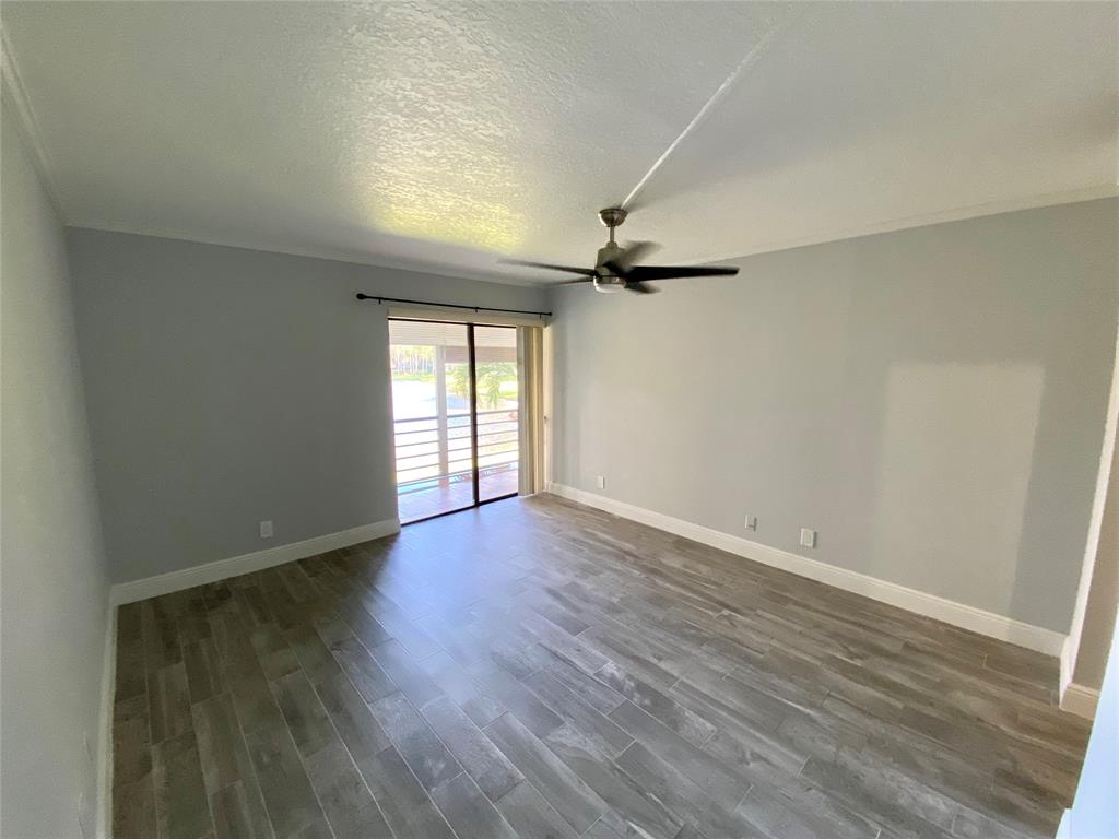Photo for 2311 S Cypress Bend Drive, 219A, Pompano Beach, FL 33069 - Listing #FX-10412204 Large Master Bedroom with View & Glass doors to patio