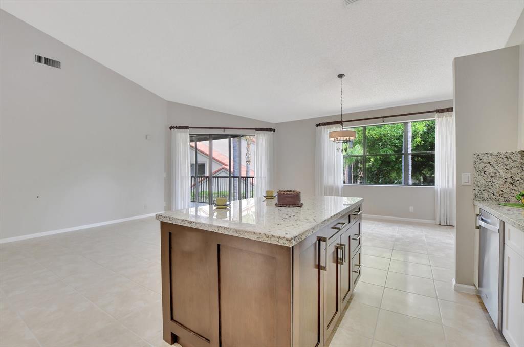 Photo for 5801 Coach House Circle, Unit E, Boca Raton, FL 33486 - Listing #FX-10436780 Island view to living areas. Open concept!