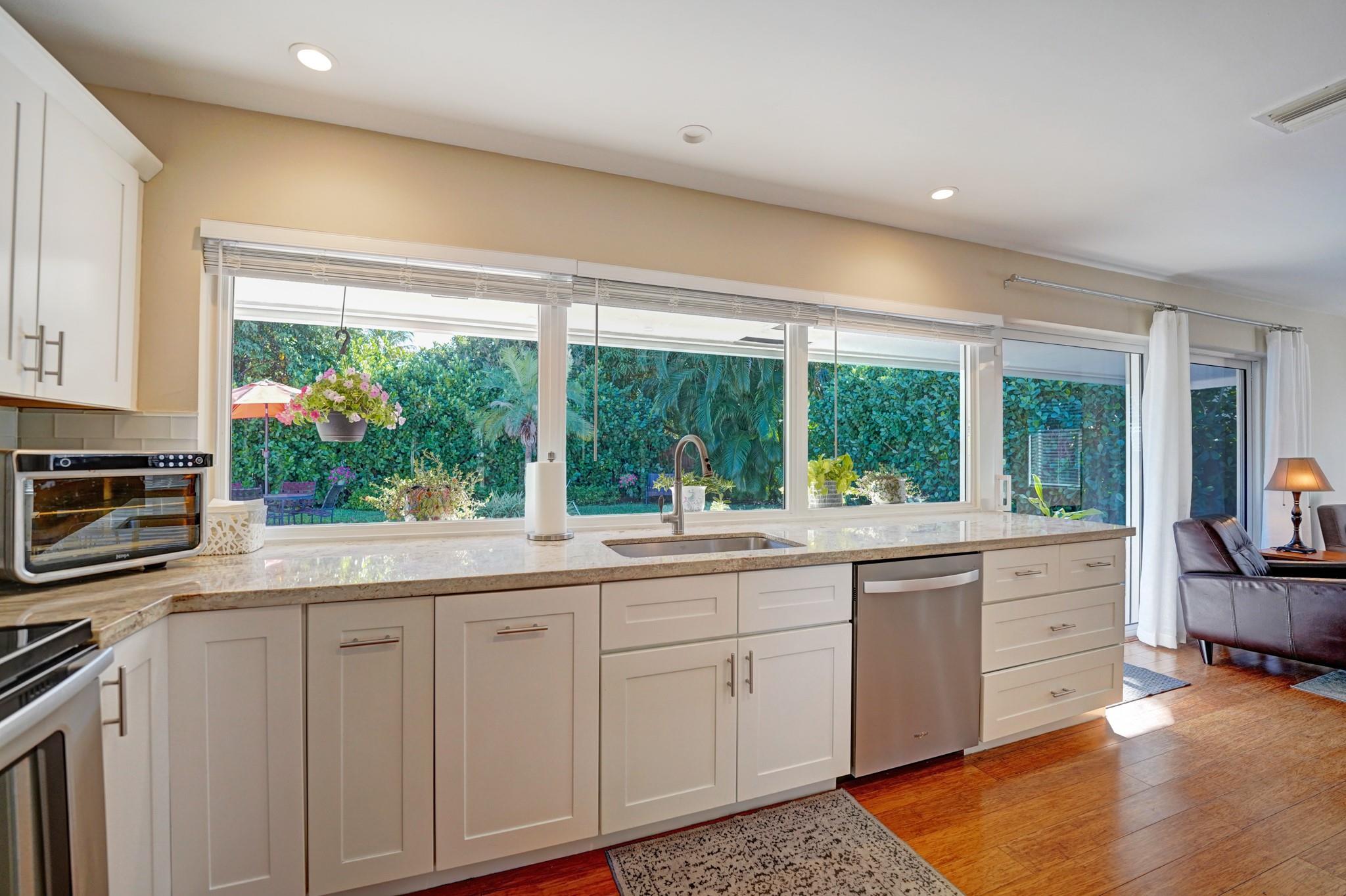 Updated kitchen with solid wood cabinetry.