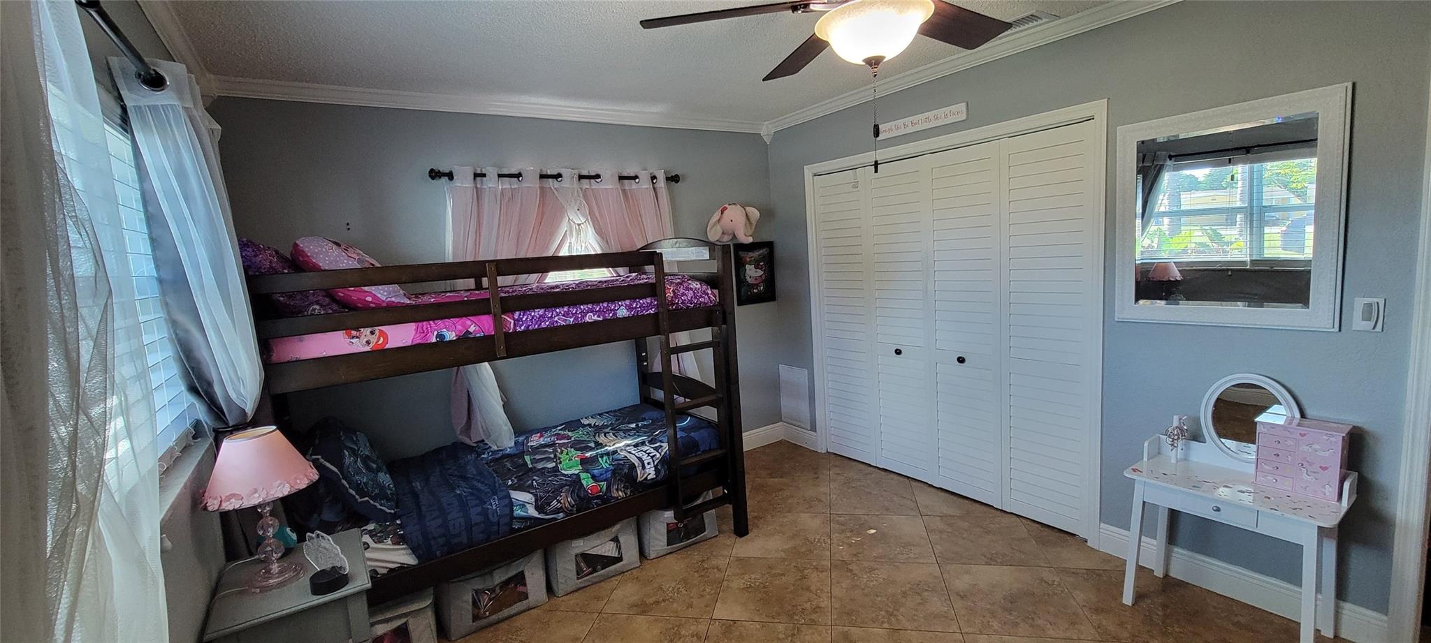 Comfortably sized bedroom with ample natural light.