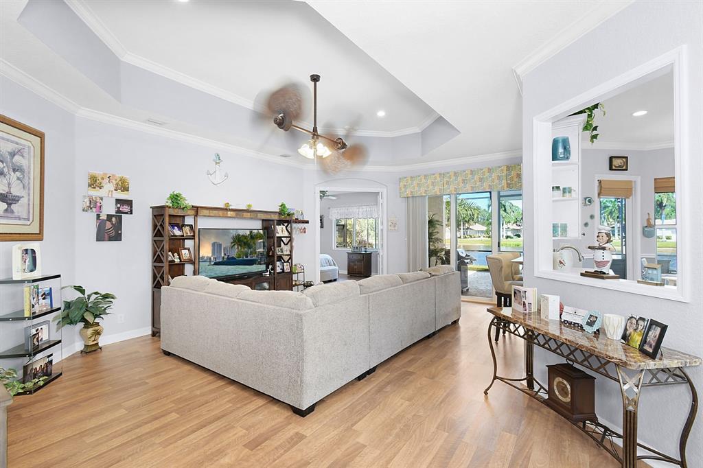 Photo for 6556 SE Broadmoor Lane, Stuart, FL 34997 - Listing #FX-10436197 A SPECIAL KITCHEN OPENING LETS THE COOK TALK WITH GUESTS