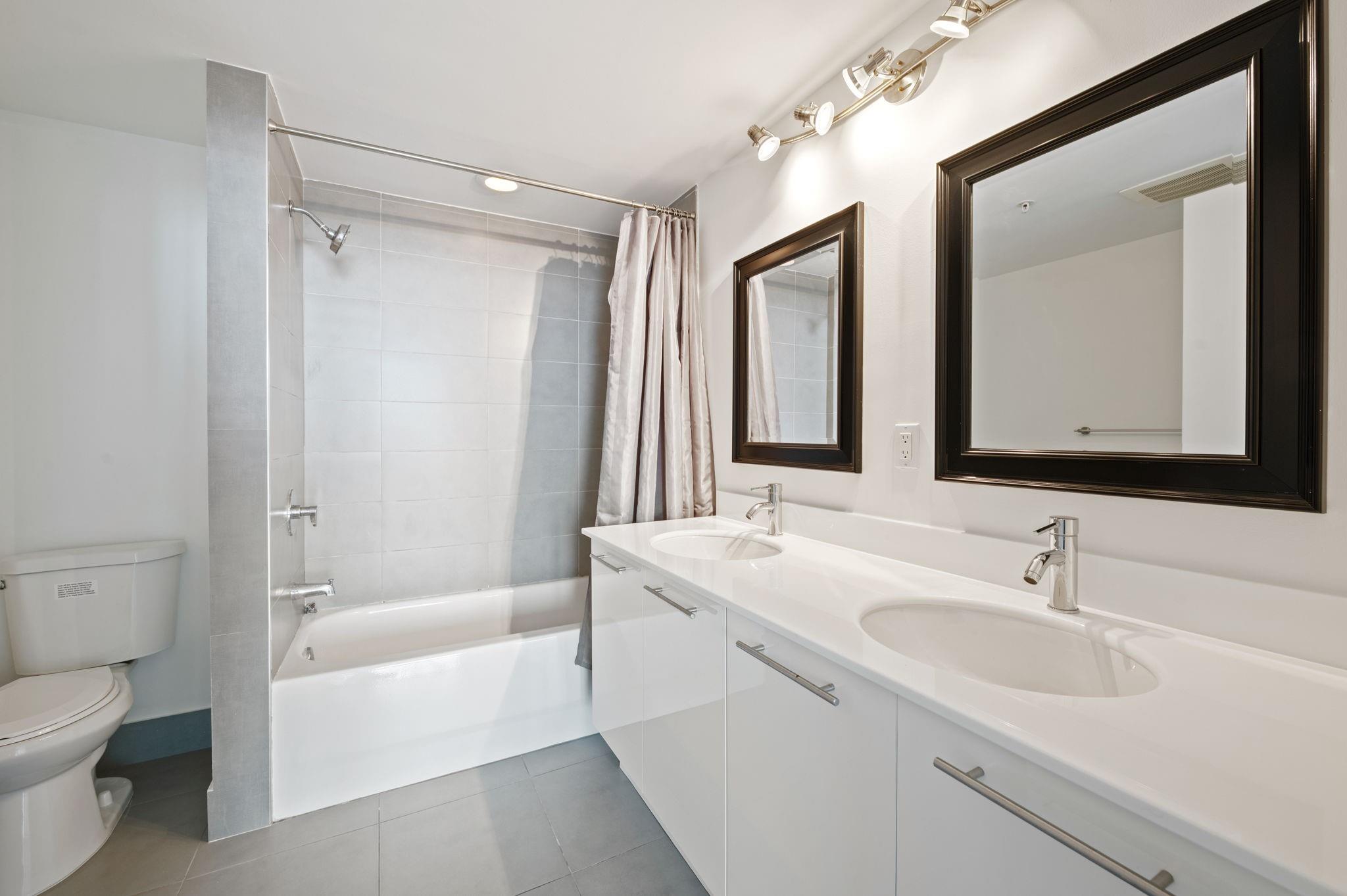 PRIMARY ENSUITE FULL BATH WITH TUB AND SHOWER AND DUAL SINKS