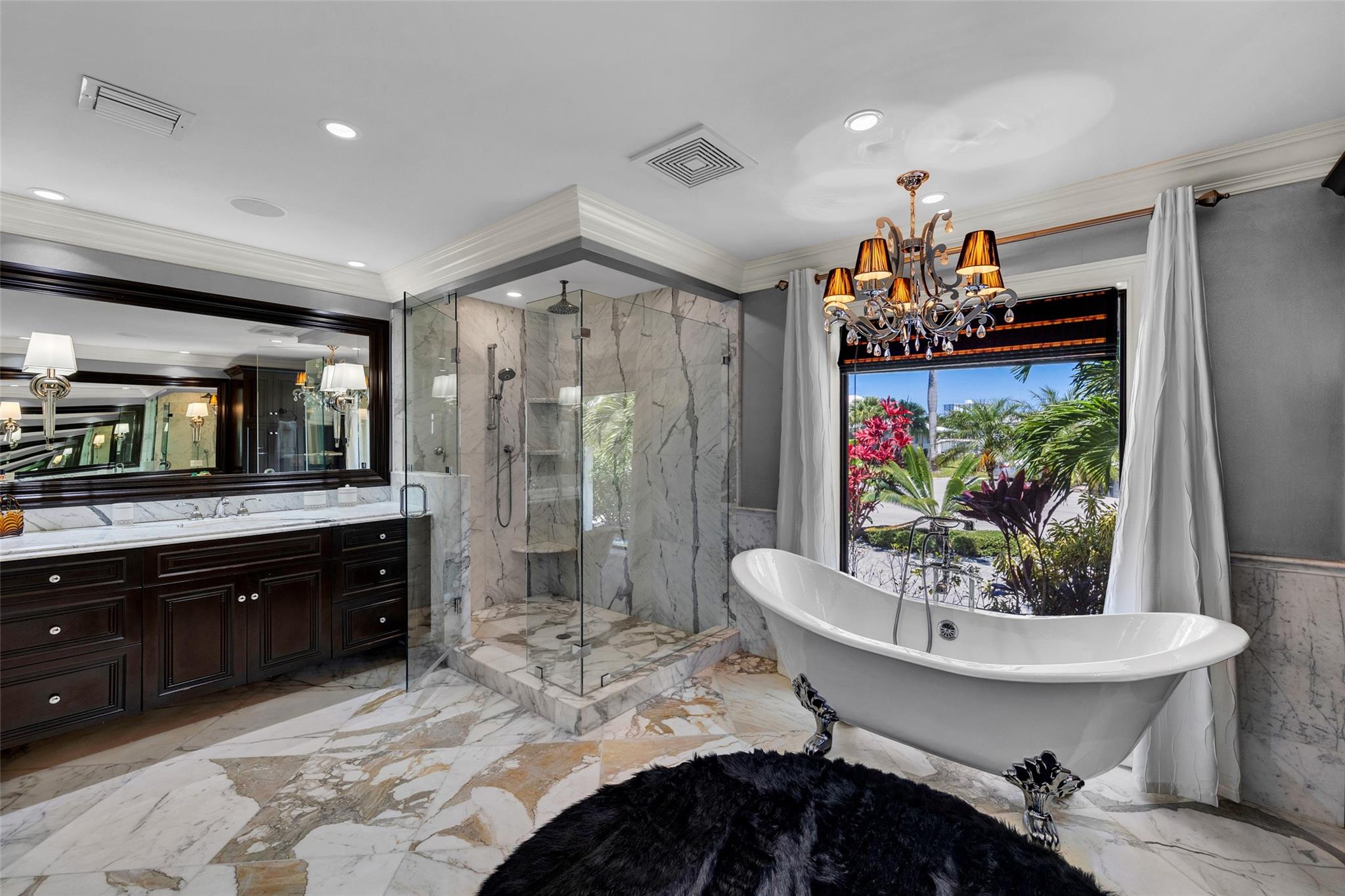 The elegant & exquisitely appointed "Her" primary bathroom suite