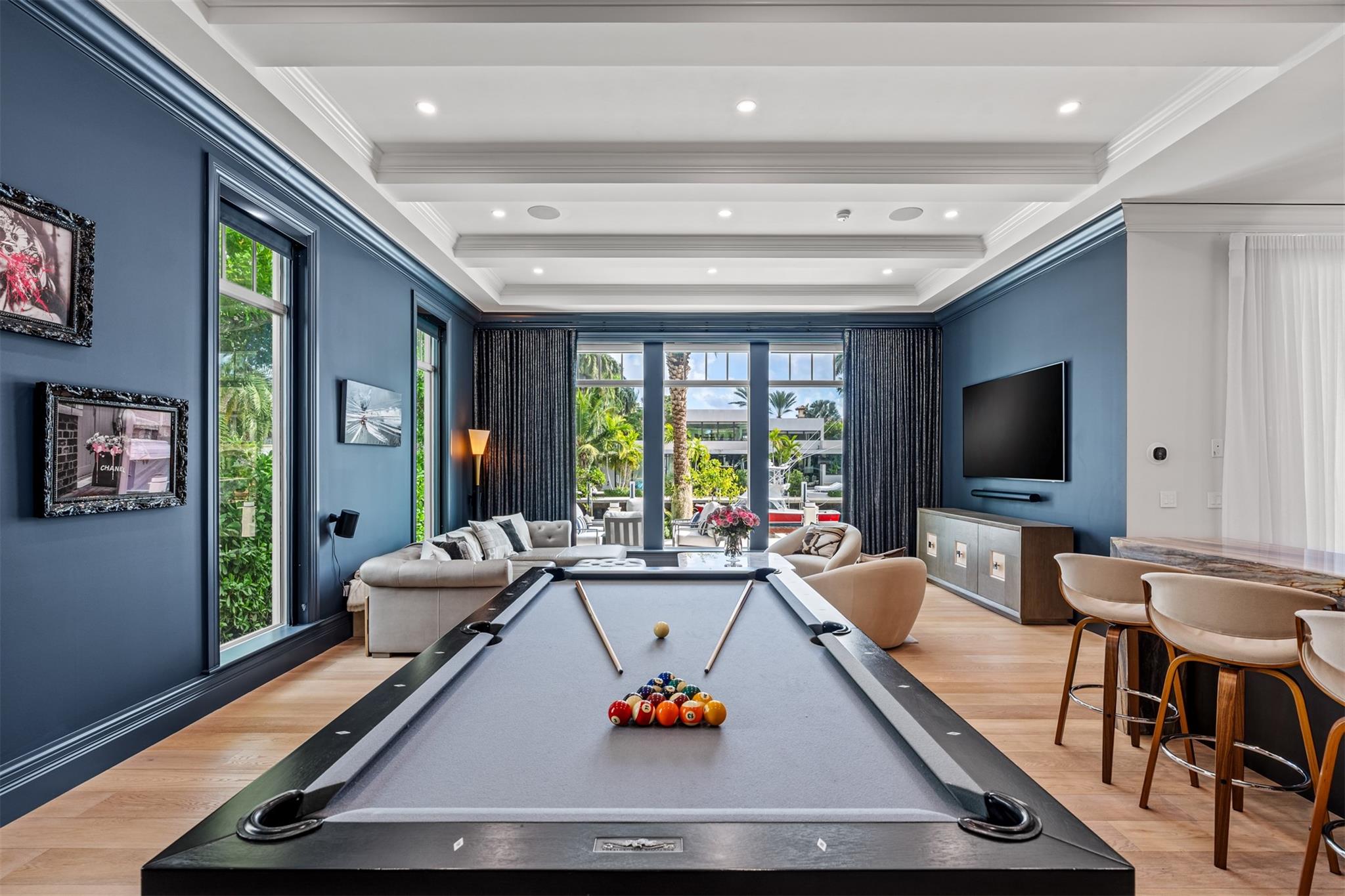 Electric shades allow you to take this room from daytime to nighttime, perfect for movie nights.