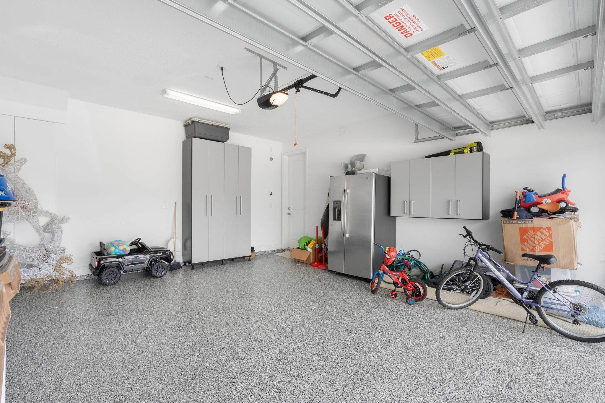 2 Car Garage with Custom Epoxy Flooring and Built in Cabinets